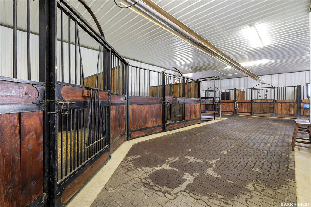Premier 40-Acre Professional-Grade Horse Acreage on Pavement – Valley Road Area!Looking for a move-in ready professional-grade training, boarding, or private breeding setup 15 minutes from Saskatoon?Step into a masterfully designed, turn-key horse acreage tucked behind a private, coded security entry gate. Featuring an incredible 60' x 60' fully heated main barn seamlessly attached to a 60' x 60' 3-sided hay barn/machinery storage unit—offering a massive 7,200 sq. ft. continuous footprint. Bypass the skyrocketing costs of commercial constructionPremium Equestrian Infrastructure:The Heated Barn: Premium 60' x 60' fully heated main barn featuring 7 stalls, heavy-duty rubber tile flooring, a commercial floor drain, dual electric overhead doors, a dedicated tack room, laundry room, bathroom, meeting room, plus + softened hot & cold water system.Continuous Footprint Storage: Attached 60’ x 60’ 3-sided clear-span hay barn and machinery storage unit, delivering a massive 7,200 sq. ft. interconnected roofline.Fencing & Turnout: Extensively cross-fenced with premium, low-maintenance 3-rail pipe fencing. Optimized layout includes 8 distinct paddocks, 3 close pastures, a sprawling 13-acre fenced back pasture, rugged field shelters, and multiple automated heated water bowls.Training Grounds: Massive 180' x 350' outdoor riding arena professionally prepped with a deep, solid engineered base for elite year-round drainage and footing.Bonus Shop: Standalone 26' x 28' shop with 14-foot clearance ceilings for trailers/equipment.The Residential Asset:Relax in a solid, mechanically updated 1,100 sq. ft. 3-bed raised bungalow featuring a new furnace,  new central AC, and an open basement rough-in ready for immediate equity expansion, plus a 2-car attached residential garage. Move your horses in and operate on day one before winter hits!