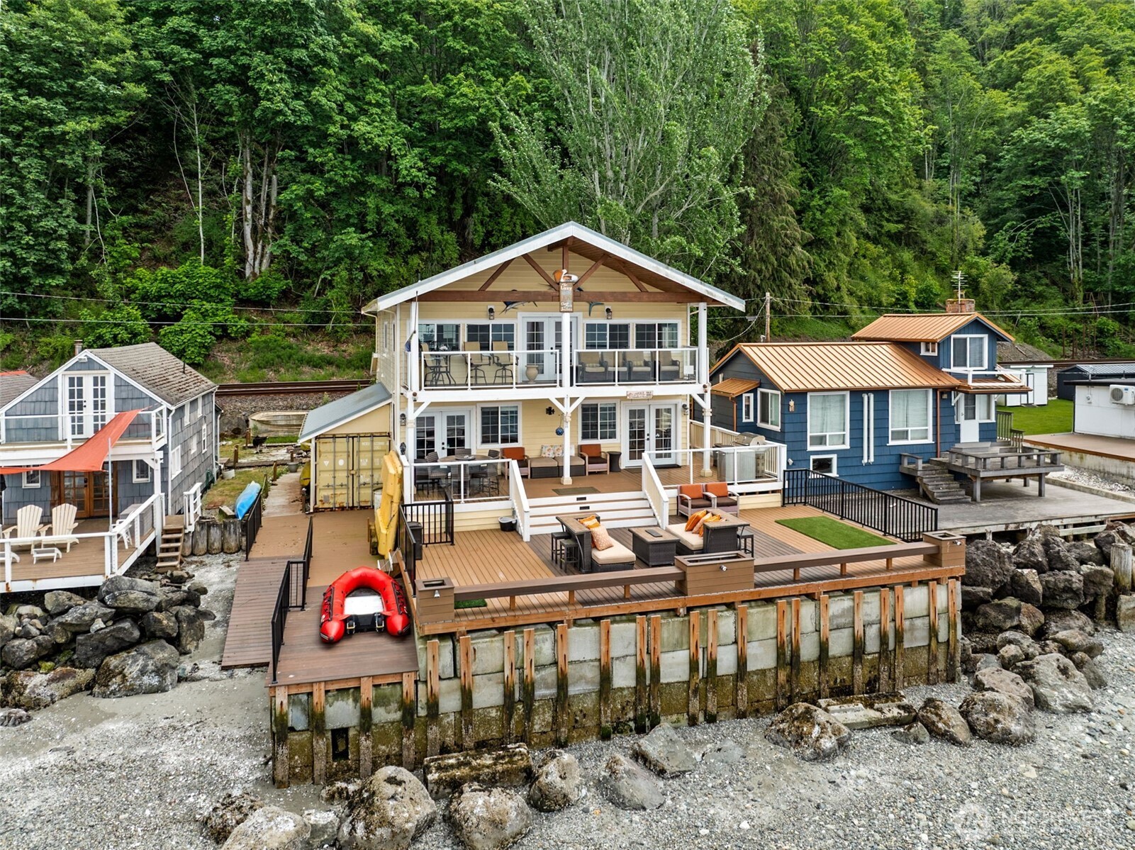Experience unparalleled waterfront living in Mukilteo! This stunning beachfront home offers breathtaking panoramic views of Puget Sound, Whidbey Island, & ferry crossings. Featuring unique floor plan & stylish design-- this fully furnished retreat offers seamless indoor-outdoor living. The gourmet kitchen boasts 2-tier granite island, & detailed high-end finishes. Vaulted bedrooms upstairs include spacious primary suite features soaking tub w water views & private deck. Enjoy a spacious deck for entertaining, a floating dock, and direct water access.  Access the home via a private lighted pathway and stairs, ensuring ultimate privacy and exclusivity. Sold as-is. Don’t miss this rare opportunity!