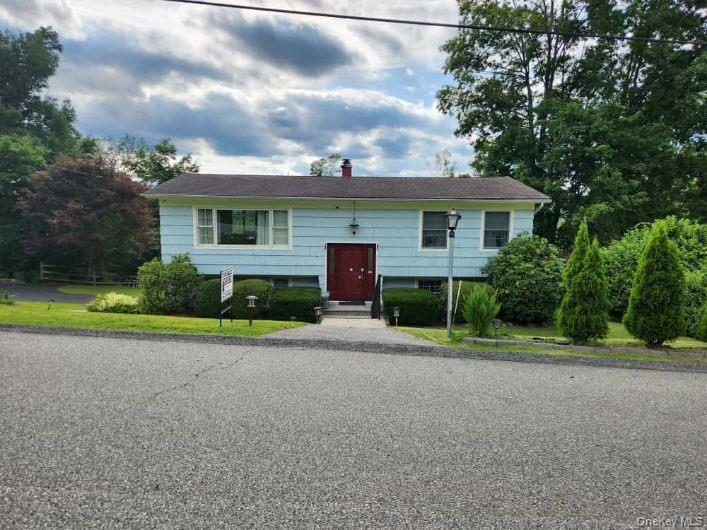 Welcome to this turnkey charming ranch! It offers an open concept, spacious rooms. Top floor offers two bedrooms, a full bathroom, kitchen with quartz countertops, finished wood floor, and updated bathrooms. Lower floor offers a family room with sliding doors that lead to a completely private deck with scenic views, a full bath, bedroom, and an office that can be used as a fourth bedroom.