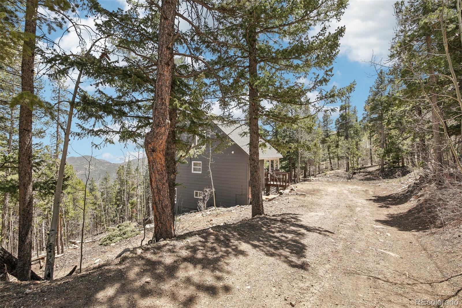 Stunning Mountain Retreat in Coal Creek Canyon – Views, Peace & Potential, discover your dream mountain home, perfectly nestled in a gorgeous, quiet corner of Coal Creek Canyon. This thoughtfully updated 5-bedroom, 3-bathroom home offers the perfect balance of serenity and convenience, with panoramic views stretching from the city skyline of Denver to snow-capped peaks of the Rockies.Step inside and be greeted by warm, inviting spaces filled with natural light and designed for comfort. One of the upstairs bedrooms is currently used as a flexible entertainment space, while another makes for an ideal home office—complete with high-speed fiber internet to keep you connected in the most tranquil setting.Whether you’re planning to settle in full-time or explore the potential as a short-term rental or Airbnb, this home checks every box.You’re perfectly positioned for adventure, with easy access to Boulder, Golden, and the outdoor havens of Nederland and Eldora—offering world-class hiking, skiing, and events. Or simply stay close to home, take a peaceful walk around the neighborhood, and connect with the amazing community that makes Coal Creek Canyon truly special.Don’t miss this rare opportunity to own a piece of Colorado paradise—whether for living, working, or hosting, this home is ready for your next chapter.
