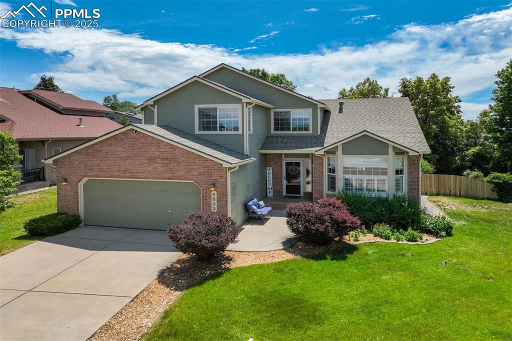 This exceptional Colorado home seamlessly blends luxurious living with thoughtful wheelchair-accessible design, ensuring comfort and independence. Step inside to an open floor plan enhanced by vaulted ceilings, hardwood floors (ideal for easy maneuverability), and a cozy gas fireplace with a brick mantle. The kitchen is a delight, featuring granite counters, ample cabinetry, and a sleek glass cooktop. The dining area offers a convenient walkout to the backyard, perfect for indoor-outdoor entertaining. The main level boasts a sophisticated owner's suite designed with handicap accessibility in mind, featuring extra-wide doors throughout for easy passage, and a zero-entry shower in the private en suite bath, offering a seamless transition for mobility aids. The owner's suite also includes cathedral ceilings, a ceiling fan, two pedestal sinks, and an oversized shower for added comfort. A convenient half bath and a private office with a bay window and French doors complete the main floor. Upstairs, a versatile loft area provides additional living space, while two large bedrooms share a Jack-and-Jill full bath. The finished basement extends the living area with wood floors, a spacious family room, a wet bar sink, and an additional bedroom with 3/4 bathroom access. Outside, enjoy the professionally landscaped yard, featuring a deck, mature trees, and a grassy area, offering a private oasis for relaxation and enjoyment. This exceptional property boasts a newly installed roof (2025), providing excellent weather resistance, improved energy efficiency, and a fresh, modern aesthetic.