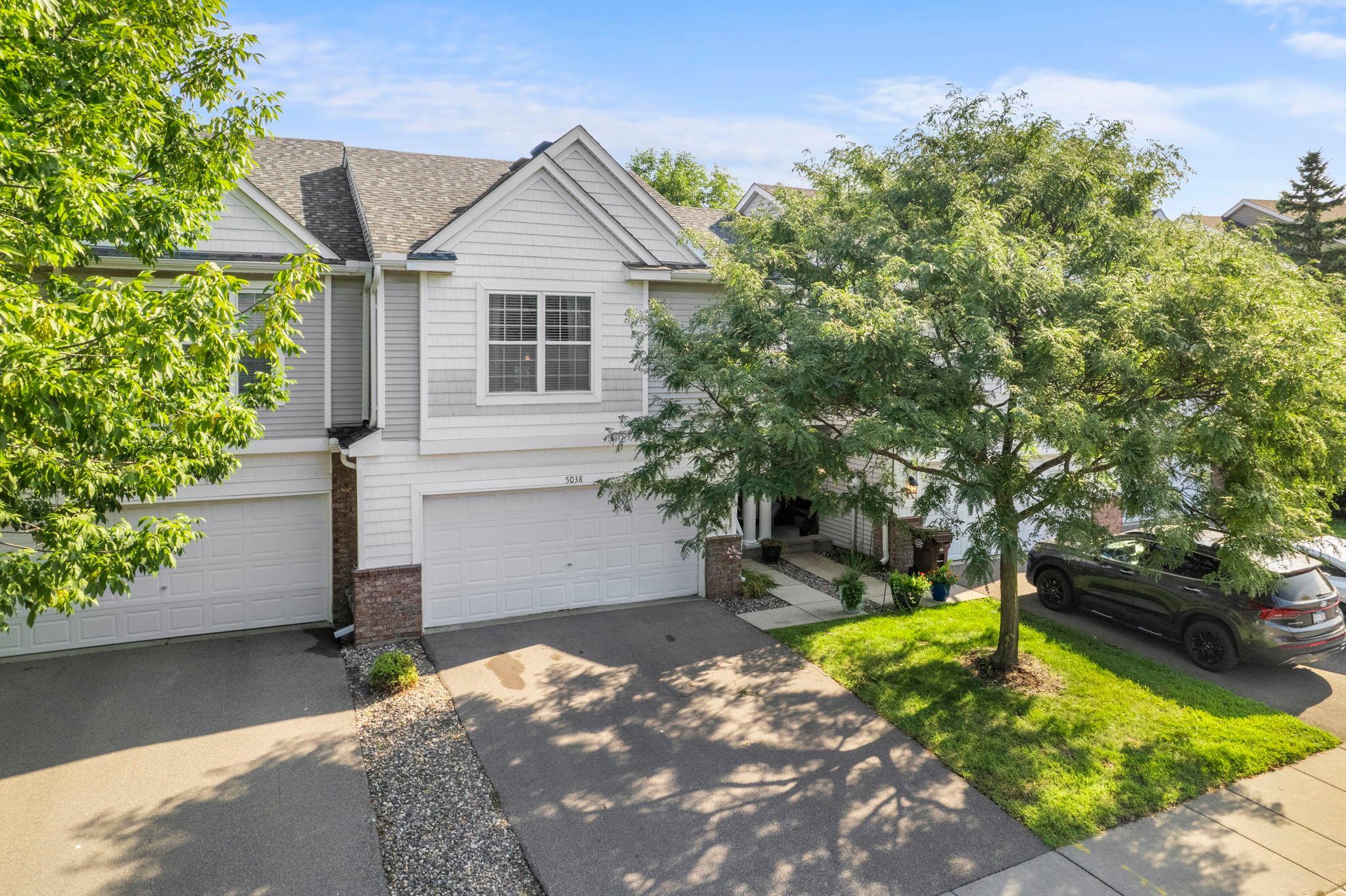 There’s an easy sense of comfort to this 3-bedroom, 2-bathroom Prior Lake townhome, with an open and connected layout that offers plenty of flexibility for everyday living!The location is hard to beat, with shopping, dining, parks, schools, and convenient access to 35W and 169 nearby, plus the Prior Lake Farmers Market and Lakefront Music Fest just a short distance away. Natural light fills the main level, where the living room flows into the kitchen and dining area. The kitchen features plentiful white cabinetry, sleek appliances, and a large peninsula with seating. Upstairs, the primary bedroom includes a walk-in closet and walk-through access to the full bathroom, while a second bedroom and convenient upper-level laundry complete the floor.The finished lower level offers a spacious family room with patio access, third bedroom, and 3/4 bathroom, creating a versatile space for guests, hobbies, or relaxing.Enjoy both a private deck and patio, mature trees, and an attached 2-car garage. HOA covers lawn care, snow removal, garbage, roof, driveway, and exterior maintenance. Thoughtful updates throughout add to the appeal!