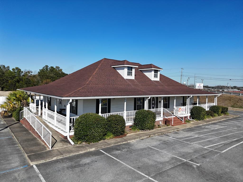 Highly visible commercial property located at the corner of 2nd Avenue and Highway 93, positioned at the bottom of the overpass for exceptional traffic exposure. The 2,480 square foot building is currently operating as a daycare and was previously used as an insurance office, offering flexibility for a variety of professional, medical, or service-based uses. The property is handicapped accessible and conveniently located near shopping, schools, and restaurants, making it ideal for businesses seeking accessibility and strong surrounding amenities. Corner-lot positioning and ease of access enhance both visibility and customer convenience in this sought-after location.