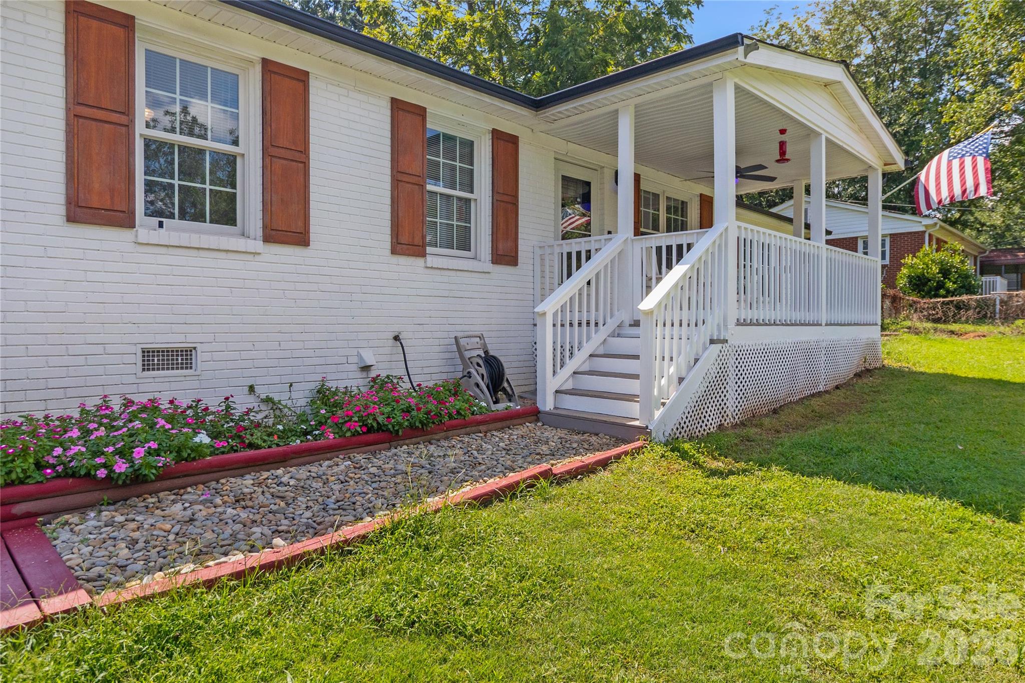 Peaceful country living in a mountain setting, just minutes from everyday conveniences! Located only 4 miles from I-85 and approximately 3.5 miles from Crowders Mountain State Park. Crowders Mountain State Park features two scenic mountain peaks with breathtaking views of the surrounding Piedmont, making it easy to enjoy hiking, nature, and the outdoors close to home.Inside, this well-maintained single-family home offers 1,759 square feet of living space on a 0.37-acre lot and features three bedrooms and two full baths. The spacious eat-in kitchen seamlessly connects to the dining room and features newer stainless-steel appliances, including a gas range, convection oven, French-door refrigerator, ENERGY STAR® dishwasher, and built-in microwave—all purchased within the last few years. The large living room has vaulted ceilings, a working wood-burning fireplace, and a distinctive feature wall that adds warmth and character. The spacious primary suite includes an ensuite bathroom and two closets, including a walk-in closet, while the private primary bath features a tiled shower. The generously sized guest bath also features a tiled shower and linen closet, while a dedicated laundry room provides convenient additional storage.Step outside to enjoy the covered rocking-chair front porch with a ceiling fan, or head to the covered back deck overlooking the expansive, fully fenced backyard, complete with a firepit and plenty of space to relax or entertain. A spacious outbuilding with electricity, added in 2021 and previously used as a workshop, provides additional flexible space for hobbies, projects, or storage.Numerous updates provide added peace of mind, including a new roof and gutters (2025), freshly painted front door and interior (2026), a new vapor barrier (2026), septic pumped (2026), a crushed gravel driveway (2025), all-new flooring (2024), a chimney cap and flue (2022), outbuilding (2021), and heating & cooling system (2020). No City Property Taxes. USDA Eligible.