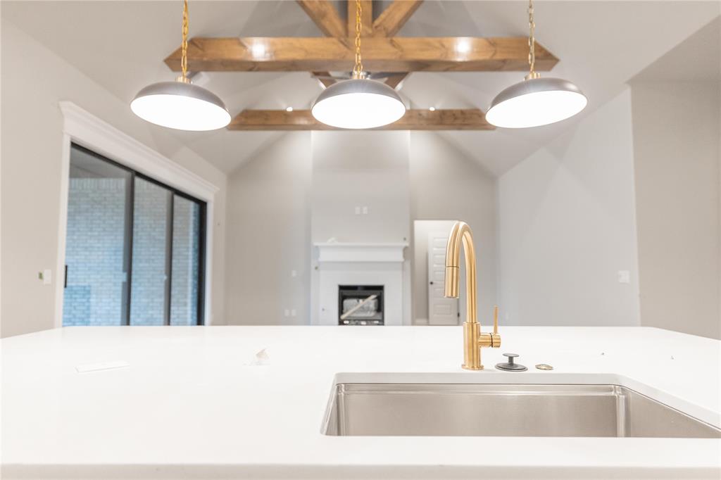 This Korbyn Bonus Room floor plan includes 3,895 Sq Ft of total living space, which includes 3,625 Sq Ft of indoor living space and 270 of outdoor living space. There is also a 690 Sq Ft, three-car garage with a storm shelter installed. This truly spectacular home offers 5 sizeable bedrooms, 4 full bathrooms, a half bath, 2 covered patios, an In-Law/guest suite, a mud area, a utility room featuring a utility sink, and a generous bonus room. Pass the covered front porch and the dual height entry lies the ultimate floor plan. The great room embraces wood-look tile, a spectacular cathedral ceiling with a crows feet detail, a ceiling fan, a luxurious 3-panel sliding door with a 4' back patio extension, and a center gas fireplace surrounded by our stacked stone detail. The great room opens to the kitchen, which boasts an oversized center island with a trash can pullout, custom-built cabinets to the ceiling, 3 CM countertops, a HUGE walk-in pantry, stainless steel appliances, including double ovens and a 5-burner cooktop, adorning tile backsplash, stunning pendant lighting, and ample storage opportunities. The secluded primary suite features windows, our cozy carpet finish, a ceiling fan, and our sloped ceiling detail. The outstanding primary bath features a European walk-in shower, a separate sink vanity concept, a free-standing tub, a private water closet, & TWO primary walk-in closets. Bedroom #2 lies towards the front of the home and spotlights an In-Law/guest suite set up with a walk-in closet included. The second level holds the generous bonus room, a full bath, a Jack and Jill bathroom set up, and bedrooms #3, #4, and #5. Outdoor living proudly supports a corner wood-burning fireplace, a gas line for your grill, and a TV hookup. Other amenities for this stellar home include a tankless water heater, an air filtration system, a fresh air ventilation system, and so much more!