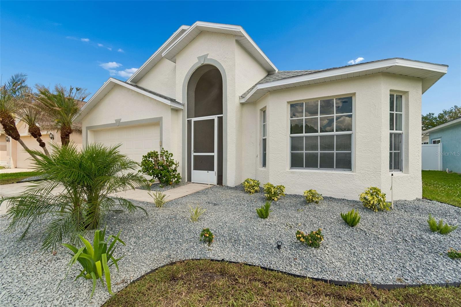 One or more photo(s) has been virtually staged. Location matters, but when it comes with space to truly live, privacy that’s hard to find, and a price-point buyers have been waiting for, you’ve found something special. Welcome to 30449 Tremont Avenue, a beautifully refreshed gated residence tucked inside one of Wesley Chapel's most desired areas. Thoughtfully designed for both everyday comfort and effortless entertaining, this spacious home offers a desirable split bedroom layout, an open concept kitchen and living area, and a separate dining space perfect for hosting holidays, celebrations, or quiet dinners at home. Natural light pours throughout the interior, creating a bright, airy atmosphere that instantly feels welcoming. Recent updates include NEW tile flooring (2026), fresh interior and exterior paint (2026), newer toilets, stylish new bathroom vanities (2026), eye-catching curb appeal with new front yard landscaping (2026), recessed lighting, NEW smoke detectors, ceiling fans throughout, A/C (2021), delivering the ideal blend of style, function, and peace of mind. One of the home’s standout features is the massive, enclosed lanai overlooking a fully fenced backyard with no rear neighbors, offering the kind of privacy and outdoor living space buyers are constantly searching for. Whether you’re entertaining guests, enjoying a quiet evening outdoors, or simply appreciating a little extra breathing room, this space was designed to be enjoyed through year-round. Located just minutes from top rated schools (award winning), shopping, dining, hospitals, entertainment, and major roadways including Bruce B Downs Blvd and SR 56, 30449 Tremont Avenue offers the ideal balance of convenience, comfort, privacy, and space in the heart of Wesley Chapel.