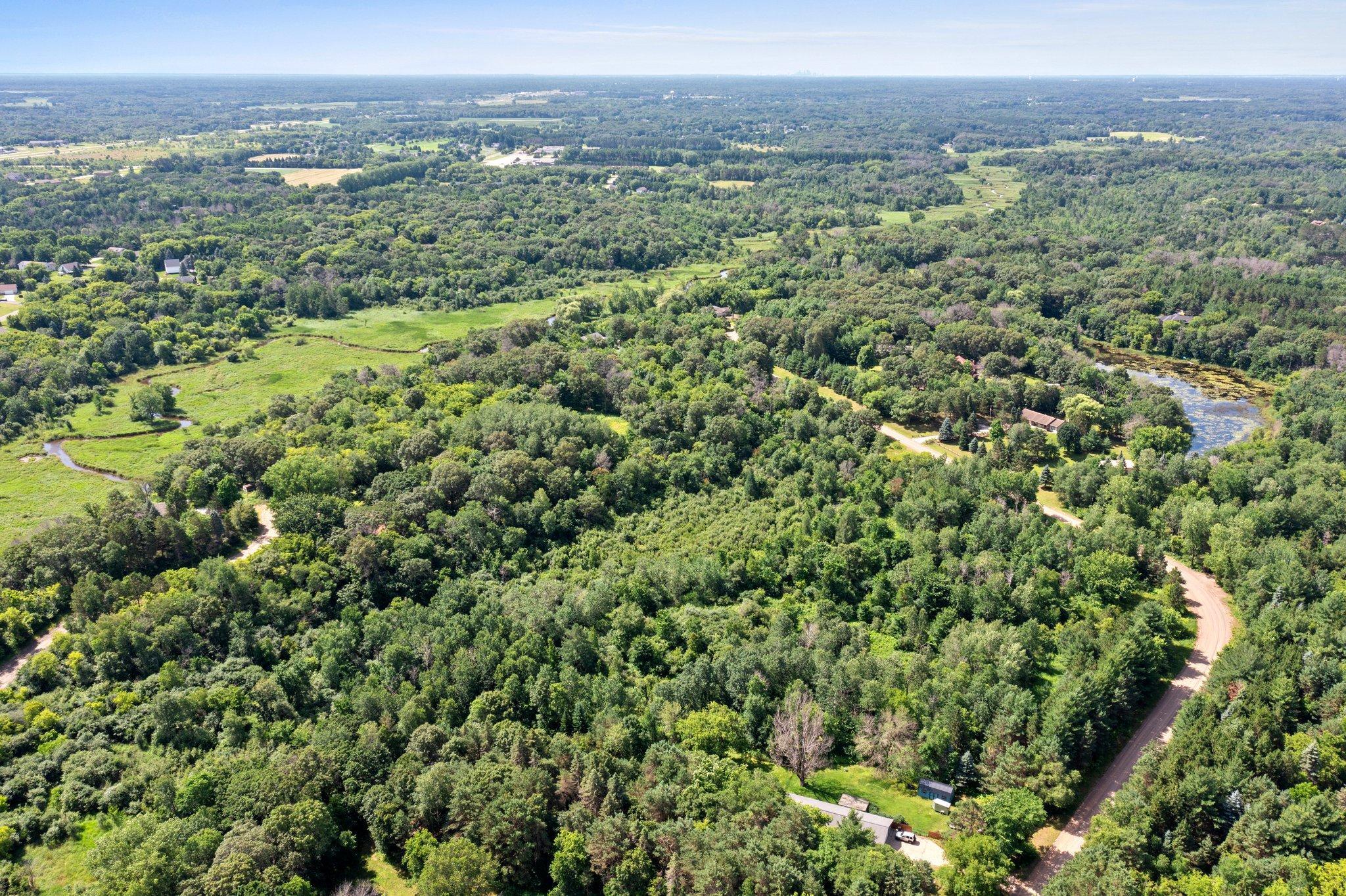 Discover your dream home site on this expansive 6-acre lot in East Bethel, open to any builder. Previously planned for a walk-out rambler, this property offers a unique opportunity to create your ideal living space. Enjoy the tranquility of being close to Cedar Creek and convenient access to The Refuge Golf Club, just a short distance away. Embrace the perfect blend of nature and recreation in this prime location.