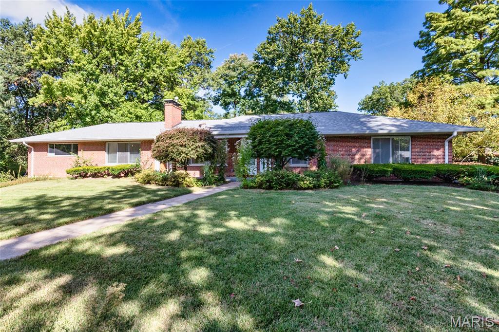 Nestled on a quiet cul-de-sac in sought-after Creve Coeur and served by the award-winning Ladue School District, this classic brick ranch offers over one-third of an acre and endless possibilities. The sun-filled living room features abundant natural light, while the dining room overlooks the picturesque backyard and flows into the kitchen with ample cabinetry and plenty of space for everyday gatherings. The spacious family room and den feature a brick fireplace and provide convenient access to the two-car rear-entry garage. The main level offers a primary suite with private bath, two additional bedrooms, and a full hall bath. The finished lower level expands the living space with a generous recreation room, office area, third full bath, and ample storage. Enjoy the home and expansive backyard as-is or explore the potential to create something new in this exceptional location. Home is being sold in As-Is condition. Schedule your showing today and discover the possibilities!