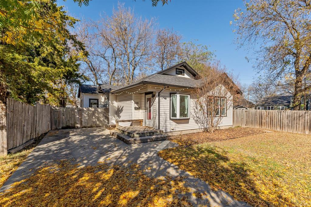 Welcome Home to 409 W Daws St! This refreshed 2-bed, 1-bath home offers 1,184sf of thoughtfully designed space, featuring a loft and an additional flex area perfect for a studio, office, or second living zone. As you enter, you will notice the warm original hardwood floors, preserved and highlighted through a full interior update completed within the last 5 years. Natural light fills the open layout, giving the home a clean, modern feel with just the right amount of character. The property includes an additional 0.10-acre lot—rare for the area—surrounded by large, mature trees that create a private, serene outdoor setting perfect for Game Days. Whether you envision an expanded yard or garden, the extra space offers exceptional versatility. Located 1 mile from campus, just under 2 miles from OU’s football stadium, a few blocks from Norman High and 2 blocks from Andrews Park, this home blends convenience with elevated style, making it ideal for personal residence, game-day retreat, or a premium rental opportunity. Many updates include a new roof in 2022, new siding in 2023, double-paned windows in the last 10 years, new hot water tank and upgraded PEX water lines under the house in 2024. The refrigerator, washer and dryer will convey with the home. This one is ready for you!