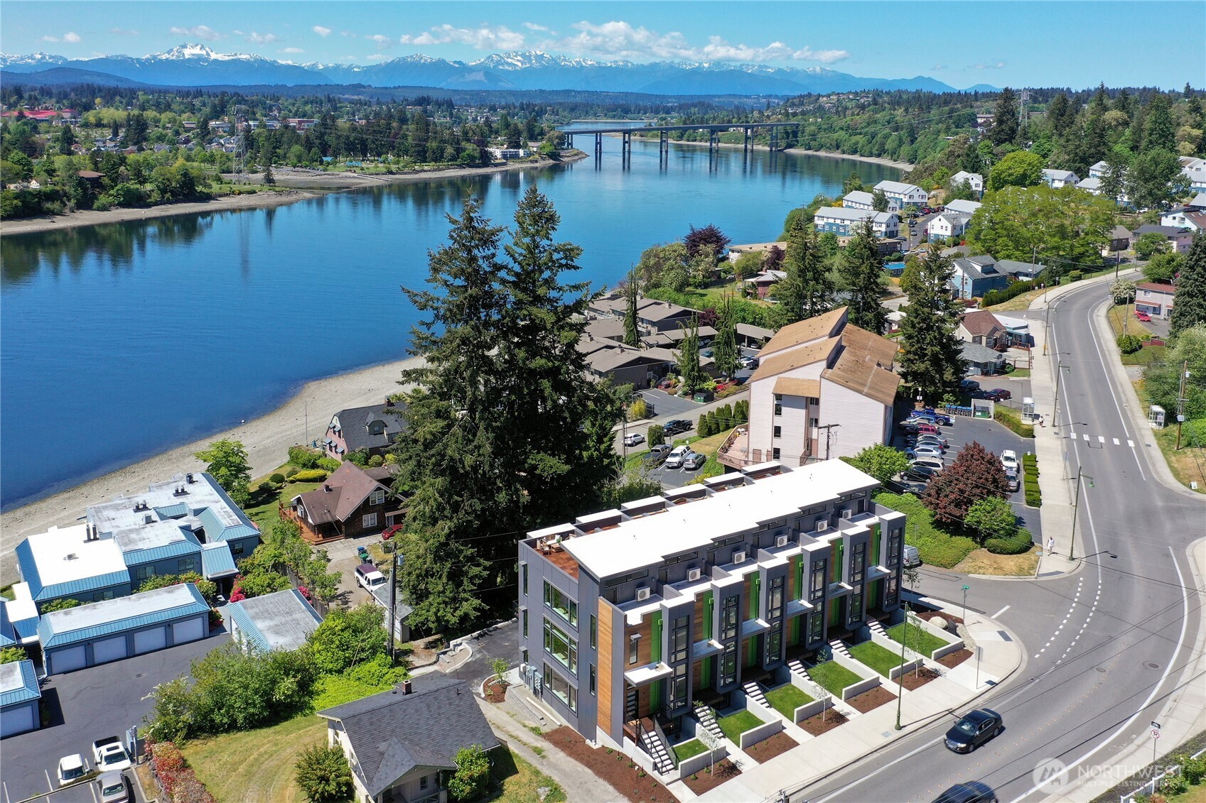 Live luxuriously in this stunning Manette townhome just blocks from dining, entertainment, and the Bremerton-Seattle Fast Ferry. Enjoy breathtaking views of the Olympic Mountains and water from large windows and two private decks, including a spacious rooftop. High-end finishes include soaring ceilings, quartz counters, elegant lighting, a sleek electric fireplace, and efficient HVAC. The primary suite features a walk-in closet and a spa-style shower. $4,800/month includes HOA dues; tenant pays water, sewer, garbage, and electricity. Peaceful, low-maintenance living with an easy Seattle commute. Also listed for sale!