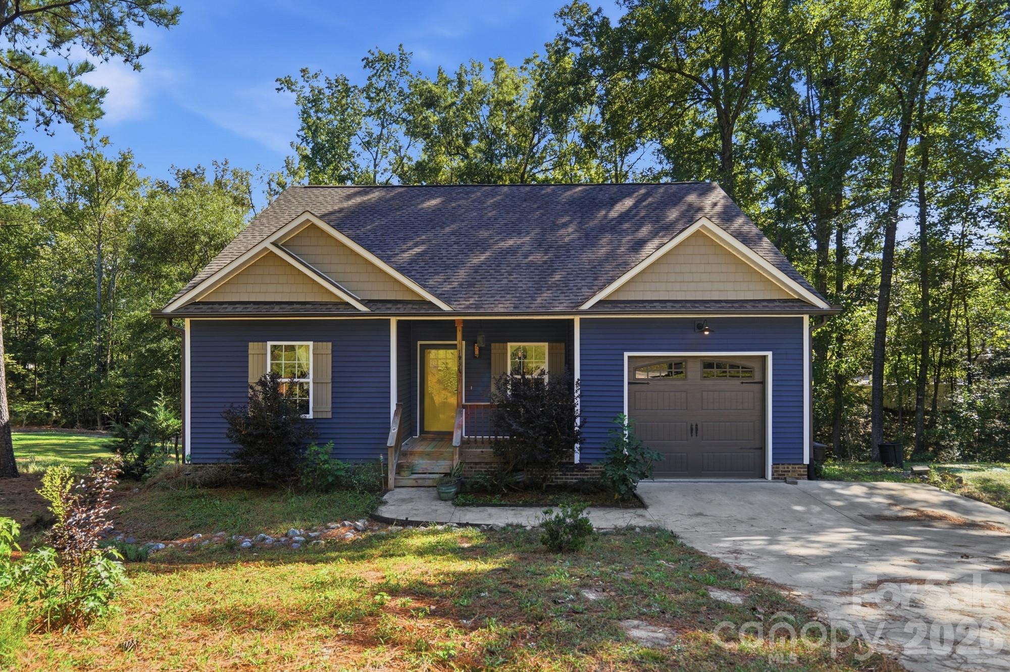 Welcome to 1534 Hathaway Drive, where privacy, comfort, and convenience come together. Situated on approximately 0.73 acres with NO HOA, this charming single-story home offers an inviting open floor plan, vaulted ceilings, and a split-bedroom layout. The kitchen features marble countertops and stainless steel appliances, while the primary suite includes a beautifully tiled walk-in shower. Enjoy your morning coffee on the welcoming front porch, spend afternoons relaxing in your spacious, private backyard, or gather with friends on the rear deck. Located in Hallmark Estates, you'll enjoy a peaceful setting while remaining convenient to downtown Rock Hill's restaurants, shopping, and entertainment, York Technical College, and I-77 for easy access to the greater Charlotte area. A wonderful combination of outdoor space, privacy, and everyday convenience.