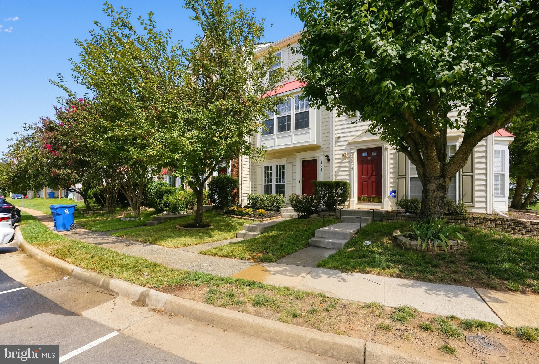 Move-in ready and beautifully refreshed, this spacious three-level townhouse offers 3 bedrooms, 2.5 bathrooms, and plenty of flexible living space. Recent improvements include new flooring, new washer, fresh interior and exterior paint, new door hardware, updated light fixtures, and refreshed kitchen and bathrooms. The bright eat-in kitchen features stainless steel appliances, island, and ample cabinet space. Generously sized bedrooms and vaulted ceiling, the walk-out lower level provides versatile space for a family room, home office,  or additional living space. Outside, enjoy a freshly repaired and painted fenced backyard along with updated landscaping and new grass in both the front and rear yards. With numerous updates throughout and a backyard overlooking an open area, this home is ready for its next owner.