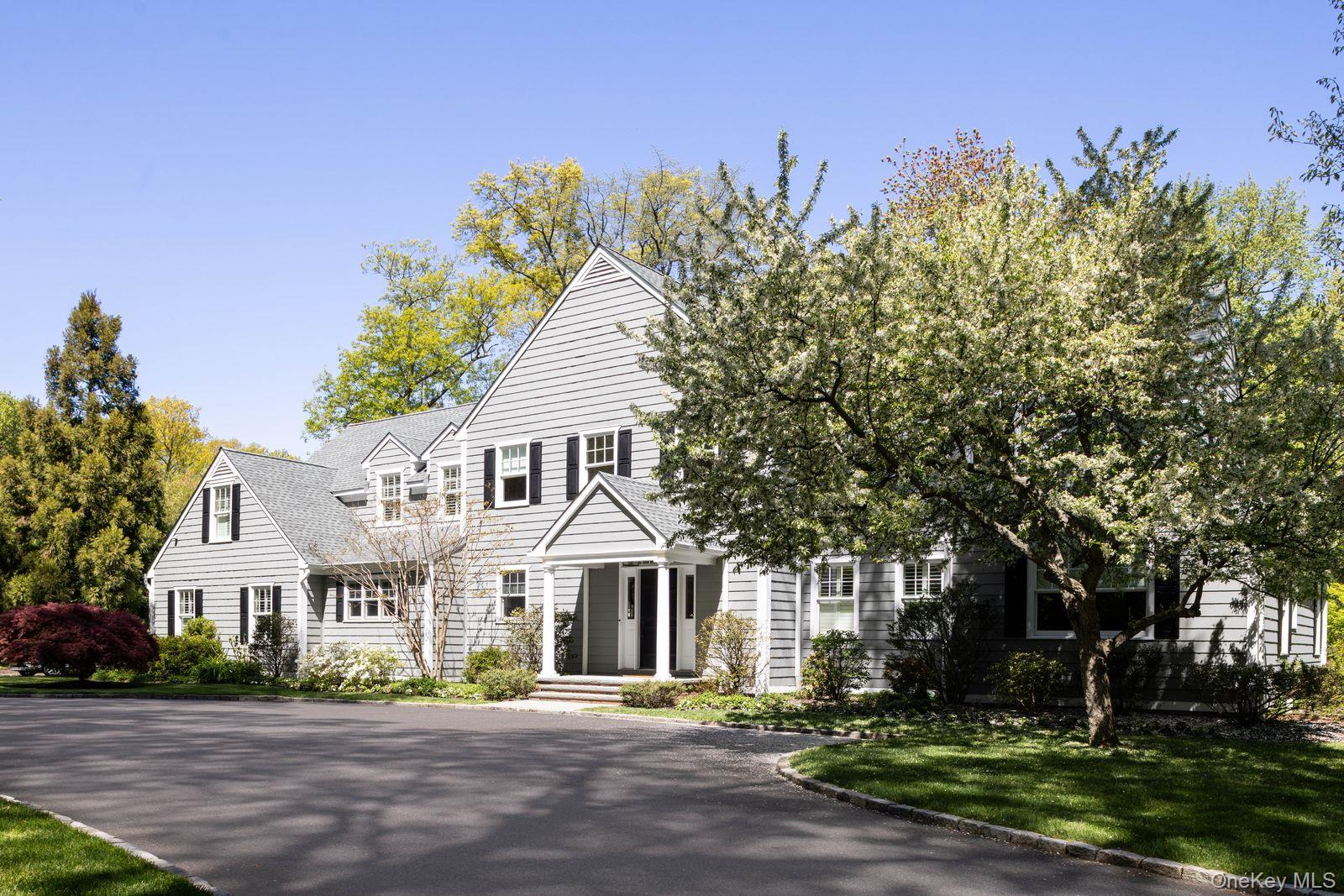 Elegant Colonial Home in Prestigious Matinecock Farms Set within the exclusive Matinecock Farms enclave, this gracious six-bedroom Colonial blends timeless architecture with thoughtful modern updates, all surrounded by beautifully landscaped grounds just shy of an acre. Backing onto a tranquil pond with preserve-like views, the setting offers exceptional privacy and natural beauty.A double-height entry foyer introduces the home's elegant, classic interiors. The formal living room, anchored by a gas fireplace, opens to a new 3 season screened porch overlooking the property, while the sun-filled dining room is ideal for entertaining. The chef's kitchen is designed for both everyday living and hosting, featuring a large center island, quartz countertops, windowed banquet seating, top-of-the-line appliances, two wine refrigerators, a spacious pantry, and a separate kitchen designed for everyday use. The library/family room offers custom built-ins and direct access to the garden. Outdoors, a bluestone terrace with dual grilling stations creates a seamless extension of the kitchen and screened in porch, making the terrace ideal for entertaining.The six bedrooms begin with a well-appointed first-floor bedroom with an updated en suite bath and a walk-in closet, providing flexibility for guests or extended stays. Upstairs, the primary suite offers a spa-like bath with a soaking tub and separate shower, along with a generous walk in closet. Four additional bedrooms, each with access to an updated bathroom, ensure comfort and privacy. A home office and separate laundry room complete the second level.Additional features include a two-car garage. Located within a meticulously maintained community, the property benefits from the Matinecock Farms Homeowners Association and its dedicated caretaker staff. HOA fee: $6,000.