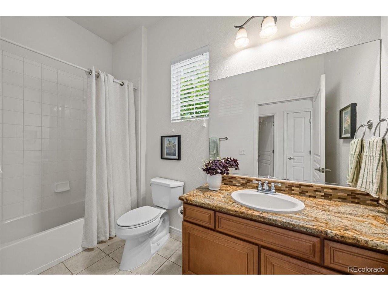 Welcome home to this rare end-unit ranch-style townhome located in the highly desirable The Broadlands Golf Course golf and pool community. This beautifully maintained 2-bedroom, 2-bathroom home offers an open floor plan filled with natural light, soaring ceilings, fresh interior paint, and brand-new carpet throughout. The spacious kitchen is the heart of the home, featuring a large center island, granite countertops, pantry, abundant cabinetry, and plenty of workspace for cooking and entertaining. The adjoining dining area is bright and welcoming, while the dedicated office provides the perfect space for working from home, hobbies, or a reading retreat. The primary suite offers a generous walk-in closet and a luxurious 5-piece bathroom. A large secondary bedroom and full bathroom provide comfortable accommodations for guests or family members. Enjoy Colorado's beautiful weather from either of the two private patios-perfect for morning coffee or relaxing while taking in the afternoon sunsets. The oversized 2-car garage provides ample storage, and the expansive unfinished basement offers endless possibilities for future living space, a home gym, workshop, or additional storage. Ideally located within The Broadlands community, residents enjoy access to golf, pools, trails, parks, and convenient proximity to shopping, dining, and major commuter routes. This rare ranch-style end unit combines low-maintenance living with exceptional space and comfort. Don't miss this opportunity!