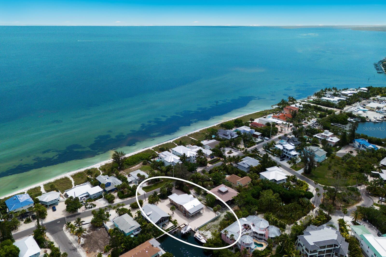 Under contract-accepting backup offers. Experience the perfect blend of modern luxury and coastal functionality in this impeccably maintained canal-front retreat. Located on the prestigious North End of Anna Maria Island, this property offers the best of both worlds: a serene, full-time sanctuary or a high-performing investment (7 nights or less).  Originally transformed by a total remodel and significant additions in 2016, this elevated 3-bedroom, 2-bathroom residence offers a sophisticated island lifestyle on an expansive, oversized lot of over 10,000 square feet. The home is thoughtfully designed for both comfort and accessibility, featuring a private elevator that services the residence with ease.  The interior transitions seamlessly from open-concept living areas to a unique ground-level bonus room. This versatile space is fully climate-controlled with its own bathroom, making it an ideal candidate for a private guest suite, a secluded home office, or a premier media/game room. Outside, the property is a true maritime sanctuary. Boaters will appreciate the 10,000 lb boat lift and the peace of mind provided by a newer seawall  - all installed in 2012.  The outdoor possibilities are as vast as the lot itself; with ample room to install a custom pool and outdoor kitchen, you can create the ultimate backyard oasis. Whether you are enjoying the breeze from the elevated decks or embarking on a sunset cruise from your backyard, 807 S Bay Blvd represents a rare opportunity to own a waterfront home built for the modern Floridian lifestyle - a true boater’s sanctuary!