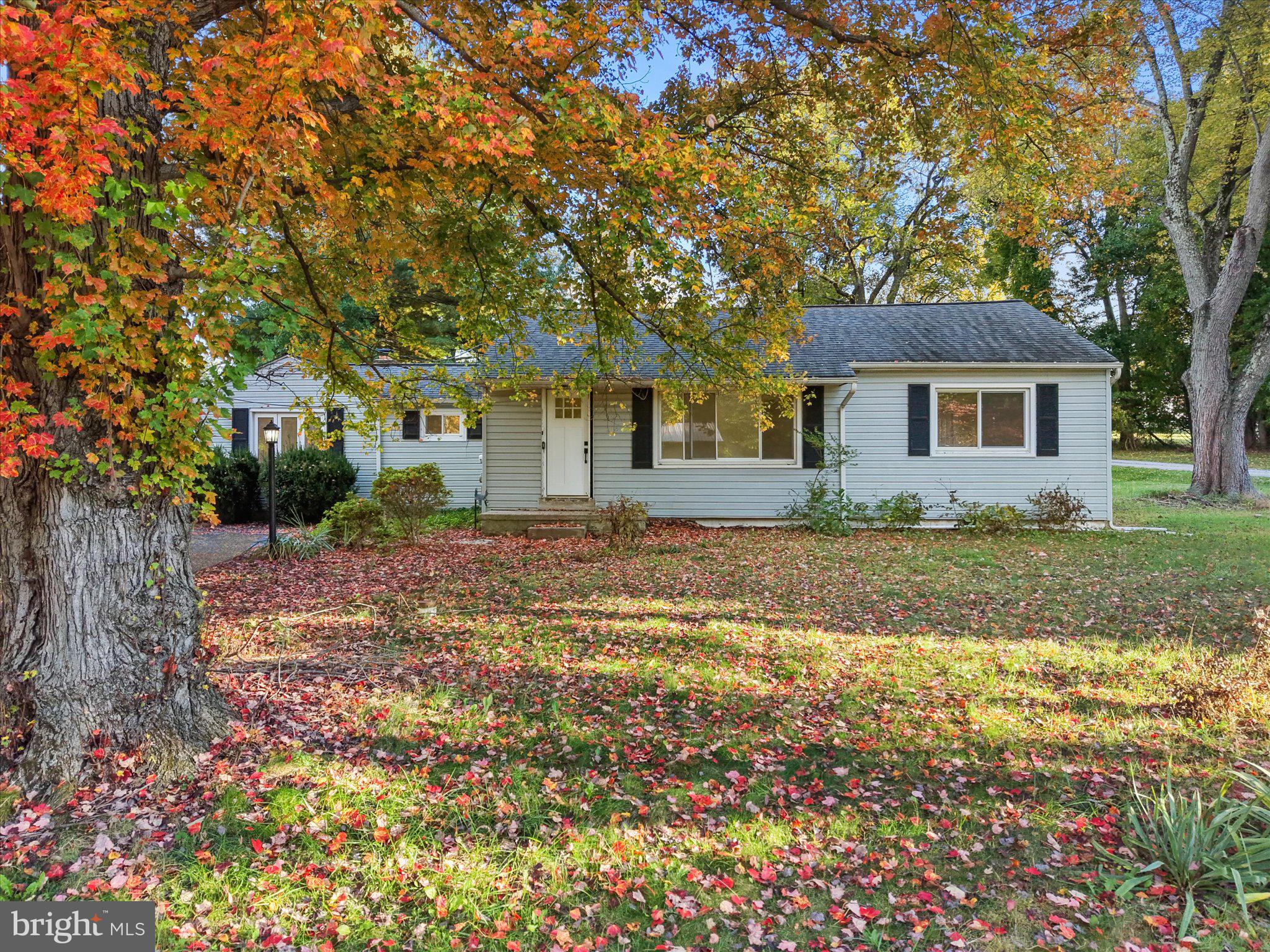 Welcome to 3392 Garnet Mine Road, a stunning, completely renovated ranch-style home tucked away in a quiet Bethel Township neighborhood! No detail has been overlooked in this top-to-bottom transformation. The main floor features an inviting living area and family room anchored by a magnificent floor-to-ceiling brick fireplace with a rustic wood mantel. Prepare to be impressed by the fully updated kitchen, boasting crisp white shaker cabinets, sleek black hardware, high-end quartz countertops, and a wide pass-through breakfast bar built for easy hosting. Beautiful wide-plank flooring runs seamlessly throughout the home, leading down to a partially finished basement. This expansive lower level drastically increases your living footprint, offering a spacious recreational room perfect for entertaining and a convenient second full bathroom. Head outside to relax or host in your large backyard, an absolute paradise perfect for summer gatherings and outdoor fun. Enjoy the peace and quiet of this neighborhood while remaining close to everything. This home sits just minutes from parks, farmers markets, local dining and major commuter routes. Don't wait! Experience 3392 Garnet Mine Road in person today!