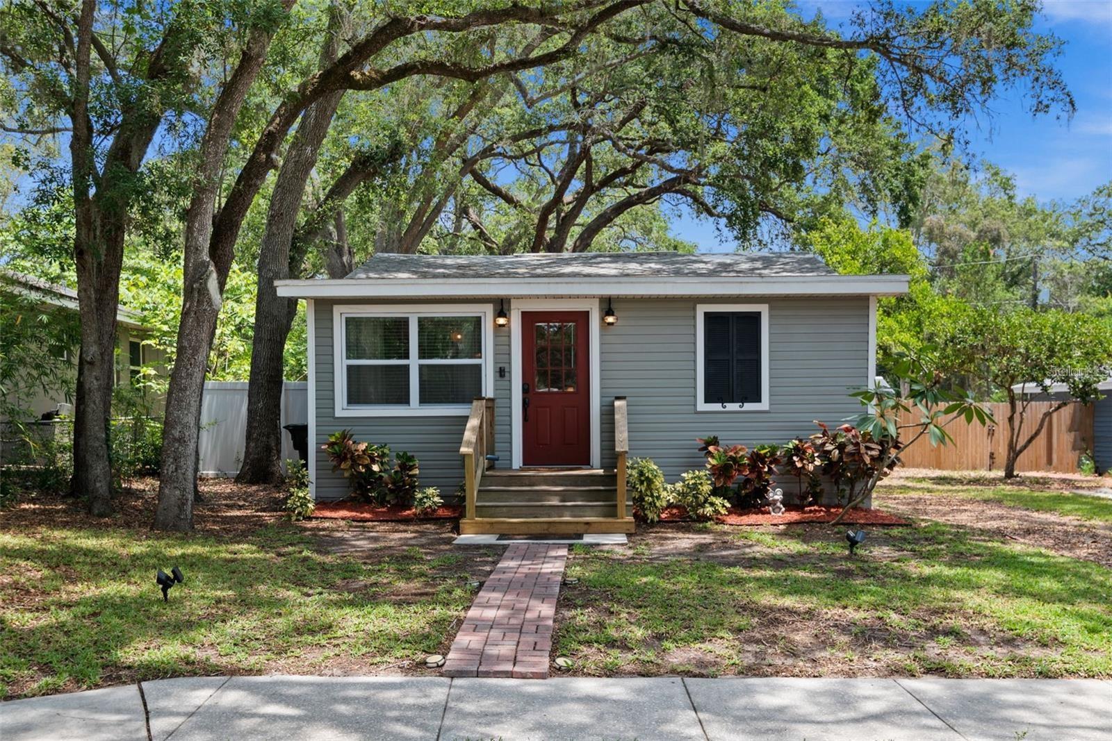 Charming renovated 3-bedroom cottage in a central location — the beach is only 10 minutes away! This move-in-ready home packs serious value into a smart, functional layout. The heart of the home is a galley kitchen finished with shaker cabinets, granite counters, and stainless steel appliances, while durable Luxury Vinyl Plank flooring carries through the entire home — perfect for sandy feet, pets, and everyday Florida living. A cleverly designed half bath doubles as the indoor laundry room and houses the water heater, keeping every square foot working for you. Generous living and dining spaces adapt easily to however you live.Big-ticket items were all addressed in a comprehensive 2016 renovation: updated electrical and plumbing, AC, added insulation in the walls and attic, vinyl siding, and impact-rated windows (Energy Star, dual-pane, Low-E, rated for the High Velocity Hurricane Zone). The result is an efficient, thoughtfully upgraded home from top to bottom.Out back, a vinyl privacy fence surrounds the yard with an eight-foot side gate — bring the boat, the RV, and the dogs. The patio is made for weekend cookouts or a quiet evening glass of wine. The lot backs up to the alley, so rear access is an easy option if you ever want it, and there's a storage shed plus enough room to add a garage down the road. Schedule your private showing today.