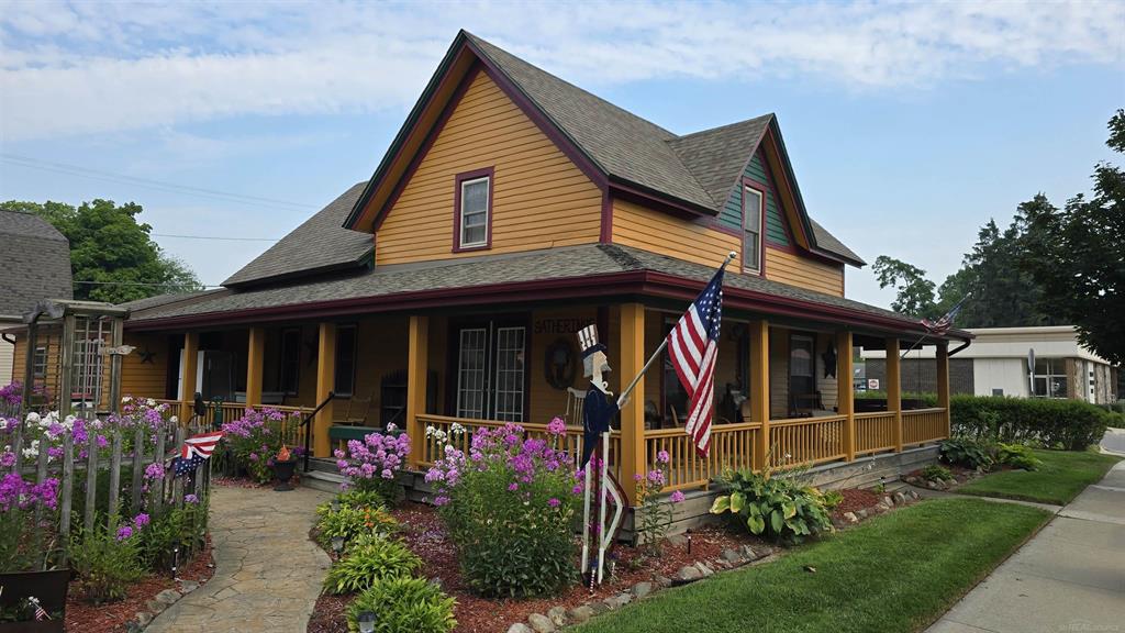 A great opportunity to live in downtown Lexington! Formerly the retail shop, Gatherings, for many years, this is within easy walking distance of everything downtown. The grounds offer very healthy perennials for every season, making the curb-appeal even more desirable. The 4 bedrooms, one down, 3 up are very vintage and can be decorated with a variety of styles. The property has been well-maintained over the years, but it is time for someone to make even more than what it already is! How about it? Are you ready for a change? Property is also being offered as a commercial property, with inventory included, for $455,000. Extra storage with the 8 X 12 garden shed, 8 X 10 utility barn and two-story 30 X 40 barn. With the charm of the "closer up north" Village of Lexington, your business will thrive with the walkability of this location that is downtown! Bring your imagination, business plan and make your dream come true.