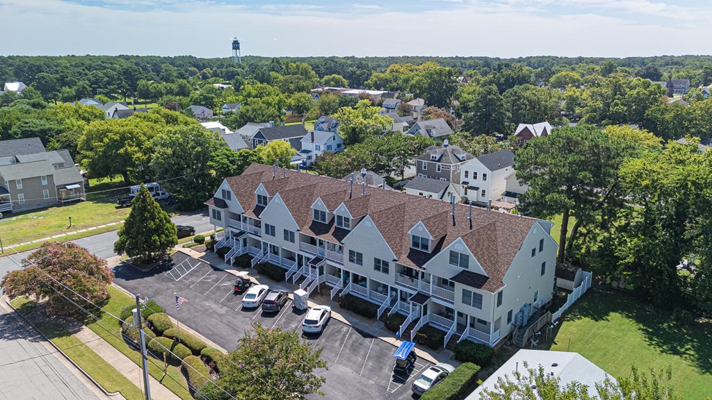 Opportunity Awaits!! This charming 2 B. 2 B. condo has been completely freshened with new paint, carpet, lighting, & SS appliances. Open floor plan with an easy flow to allow for a comfortable setting. Primary BR with sliding doors leading to your private deck, perfect for morning coffee enjoyment or evening star gazing. Enjoy the front porch with lake views. You will be pleasantly surprised with this historic town offering public beach, a variety of amazing shops, eateries, and nearby premier golf courses. No worries if you need to commute to nearby Hampton Roads area or airport only a 45-minute drive! Cape Charles offers so many exciting events for all to enjoy you will truly fall in LOVE. Bay Lake Condos offers a minimum 6 mo. rental.  Assigned parking. Golf cart friendly town.