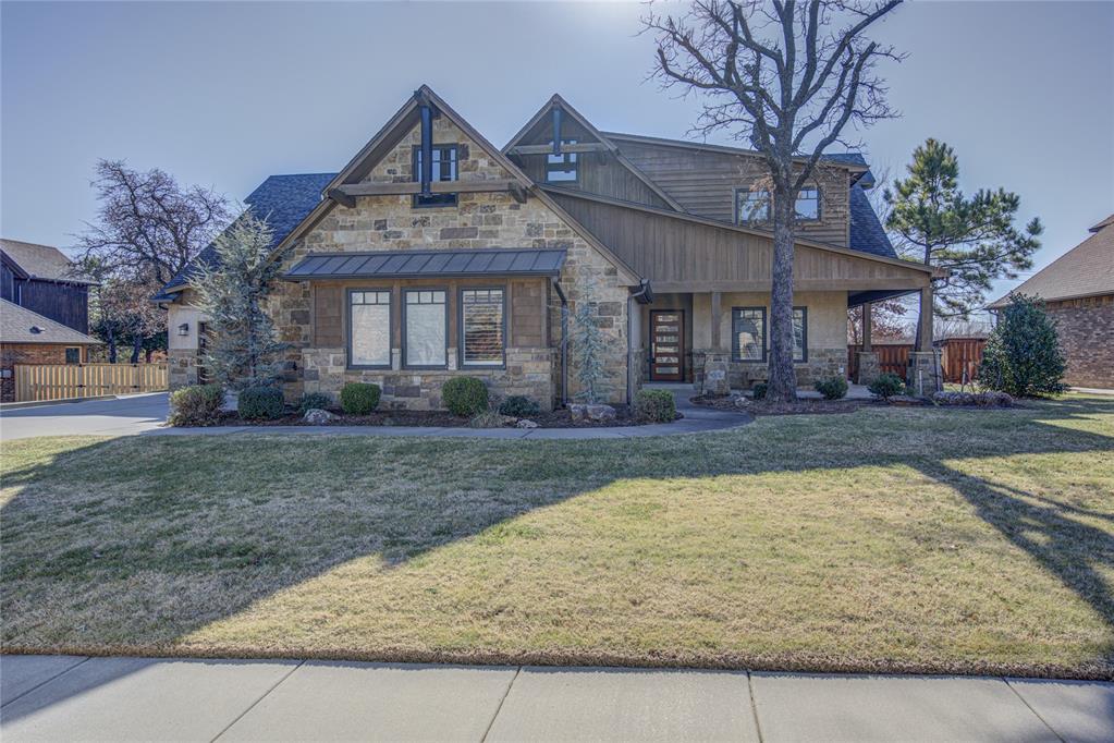 This beautiful craftsman in Iron Horse Ranch checks every box you can imagine! Scraped wood flooring flows throughout the home with a half bath to your left (upon entry) for easy guest access. The living room exemplifies grandeur with cathedral ceilings, rich wood beams, and floor-to-ceiling stacked stone fireplace. Living room flows perfectly into the dining room (floor-to-ceiling thick shiplap) and then into the kitchen. Kitchen features granite counters, pot filler surrounded by Moroccan tile backsplash, chef caliber appliances, stainless apron front sink, and large pantry. Adjacent to the kitchen is a nice built in desk, storage and mud bench. The oversized Master Bedroom also has cathedral ceilings with exposed wood beams.  Master Bathroom has expansive walk in shower with lots of natural light and his/hers vanities.  Master closet is big enough to be a bedroom with California Closet style design, built-ins and storage which feeds into the laundry room (granite  counter, undermount sink). Opposite the Master Bedroom is the office which is appointed with fireplace, built in desk, coffered ceiling and has an exit door to the exterior of the home.  Two more large rooms separated by a full bath downstairs.  Upstairs is a huge living area (could be used as a theater) with a bedroom and full bathroom.  Beyond the living area is another bonus/craft room. Lots of nice touches throughout the home such as plantation shutters, brand new carpet and refreshed paint/stain on the interior and exterior. Backyard shines with oversized covered patio, fire pit and sits on a substantial sized lot.  Amazing location, gated entry and Edmond schools.  This one has it all!