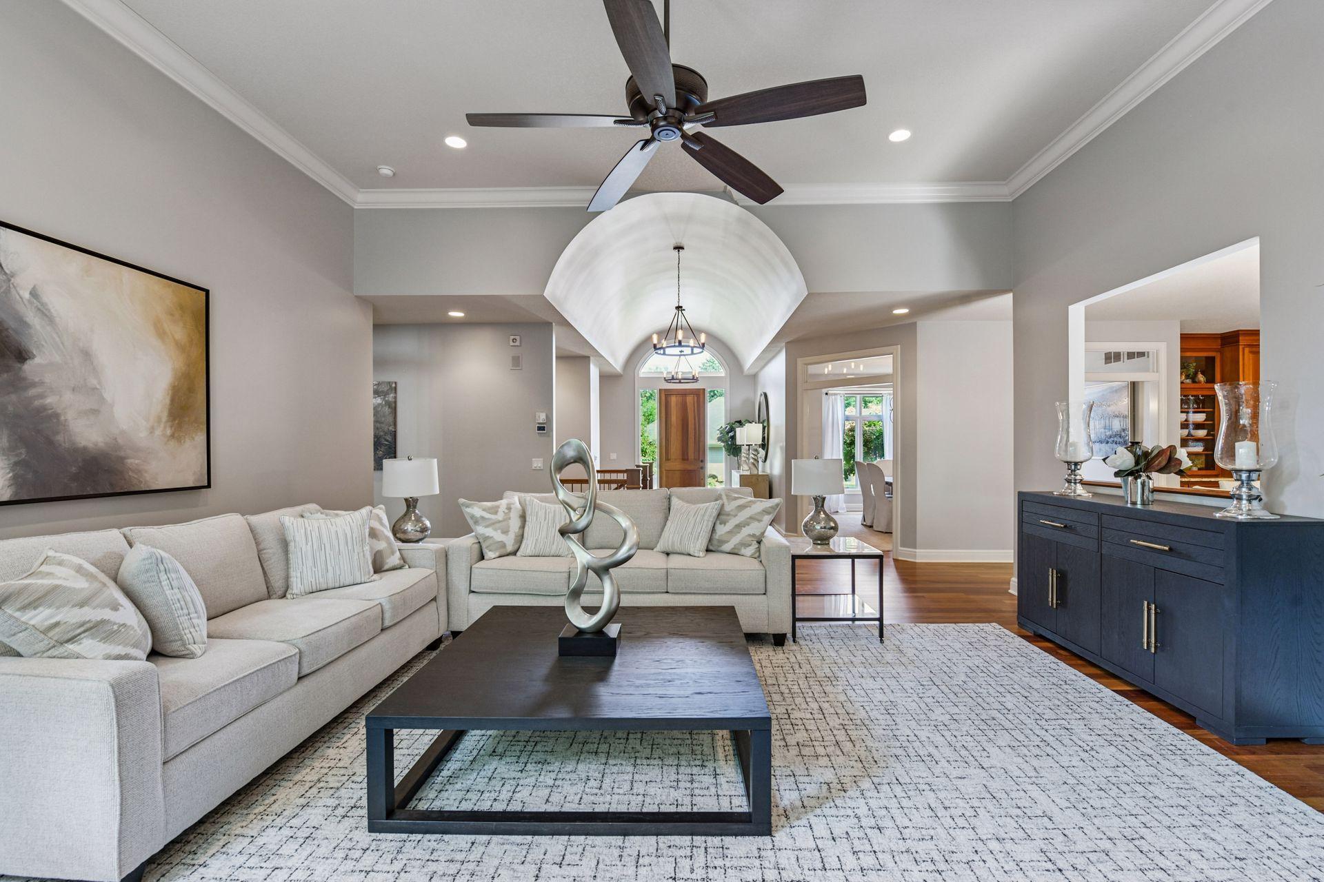 Exquisite Custom-Built Rambler with Views of Bush Lake & Anderson Lake
Experience timeless elegance in this meticulously maintained custom rambler, perfectly positioned in Bloomington with stunning views of Bush Lake and Anderson Lake. Thoughtfully updated with fresh interior paint, designer main-floor lighting, and beautifully appointed furnishings, this home radiates warmth and sophistication. The main living room is a showstopper—featuring floor-to-ceiling windows, soaring 12-foot ceilings, and abundant natural light that frames the picturesque surroundings. The oversized main-floor Primary Suite offers a tray-vault ceiling, a charming bay-window sitting nook, a spacious walk-in closet with custom built-ins, and a spa-like ensuite bath designed for ultimate relaxation. The richly finished home office impresses with cherry wood built-ins, French doors, and classic detailing, while the large gourmet kitchen is a chef’s dream—equipped with premium Sub-Zero and Wolf appliances, a generous center island, and an abundance of custom cabinetry. Both informal and elegant formal dining spaces provide the perfect settings for intimate dinners or grand gatherings.  A unique bonus room above the garage offers a peaceful retreat to enjoy elevated lake views. Downstairs, the home transforms into an entertainer’s paradise with a custom walk-behind bar, expansive living space, and views of the beautifully landscaped backyard complete with a soothing waterfall feature. The backyard also offers a screened porch and deck that lead to large stone steps descending to a hand-cut stone patio—perfect for relaxing or entertaining. Whole-home surround sound enhances the ambiance throughout.  Perfectly located close to Hyland Hills Ski Area for winter skiing and the expansive Hyland Lake Park Reserve for endless year-round activities—enjoy hiking and biking trails, water recreation, playgrounds, and more.  From its refined craftsmanship to its prime location, this home is a rare offering that blends luxury, comfort, and natural beauty.