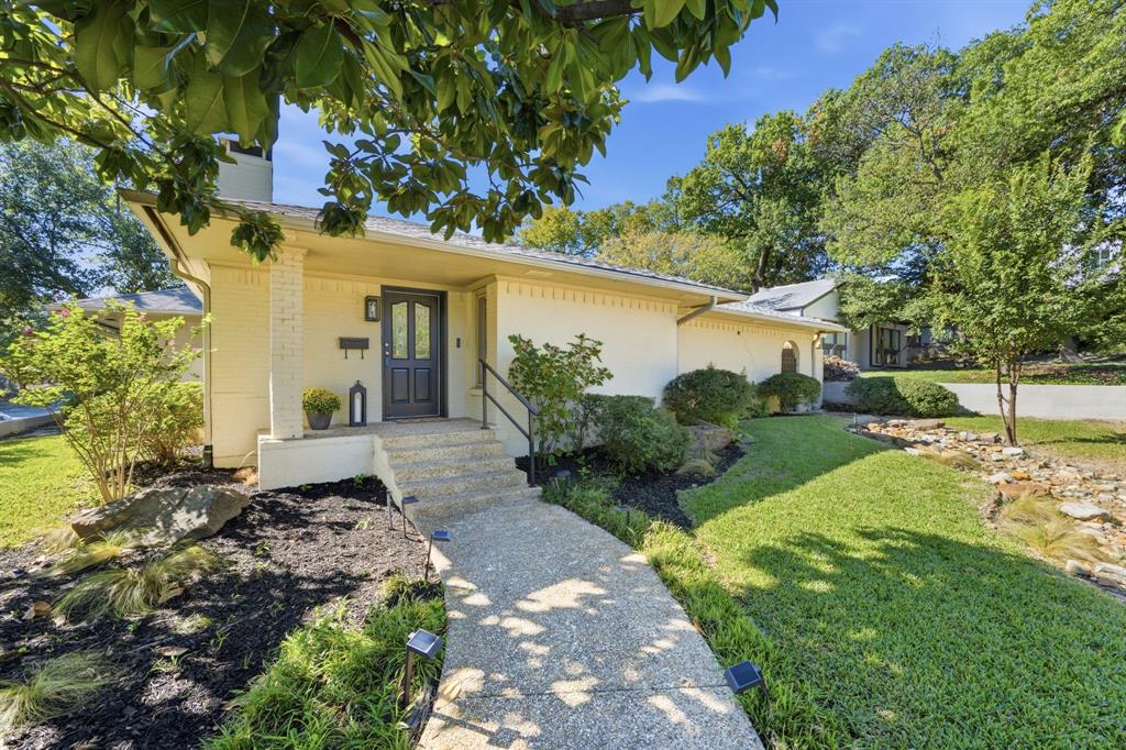 In Lakewood Elementary, under $900K usually gets you a fixer-upper and a contractor’s phone number. This one is already updated, with 3 bedrooms, 3 en-suite bathrooms, and a powder room for guests. The home is well maintained and reflects pride of ownership throughout.The kitchen features a large dry bar and a dedicated coffee station, perfect for effortless entertaining and your morning coffee ritual.Set on an expansive corner lot, the home faces Loving Avenue, with a driveway leading to a renovated two-car garage featuring durable epoxy floors and EV charger wiring. Ample street parking along Loving provides guests with plenty of room, and a substantial brick retaining wall separates the property from Gaston. The backyard is where you'll spend your weekends. It's big and green. The deck is huge, and the covered patio has room for a real dining table, so dining al fresco becomes a regular thing instead of a special occasion. Enjoy easy access to White Rock Lake, the Santa Fe Trail, and the YMCA, with the Dallas Arboretum just a five-minute drive away. Come see it before someone else does!