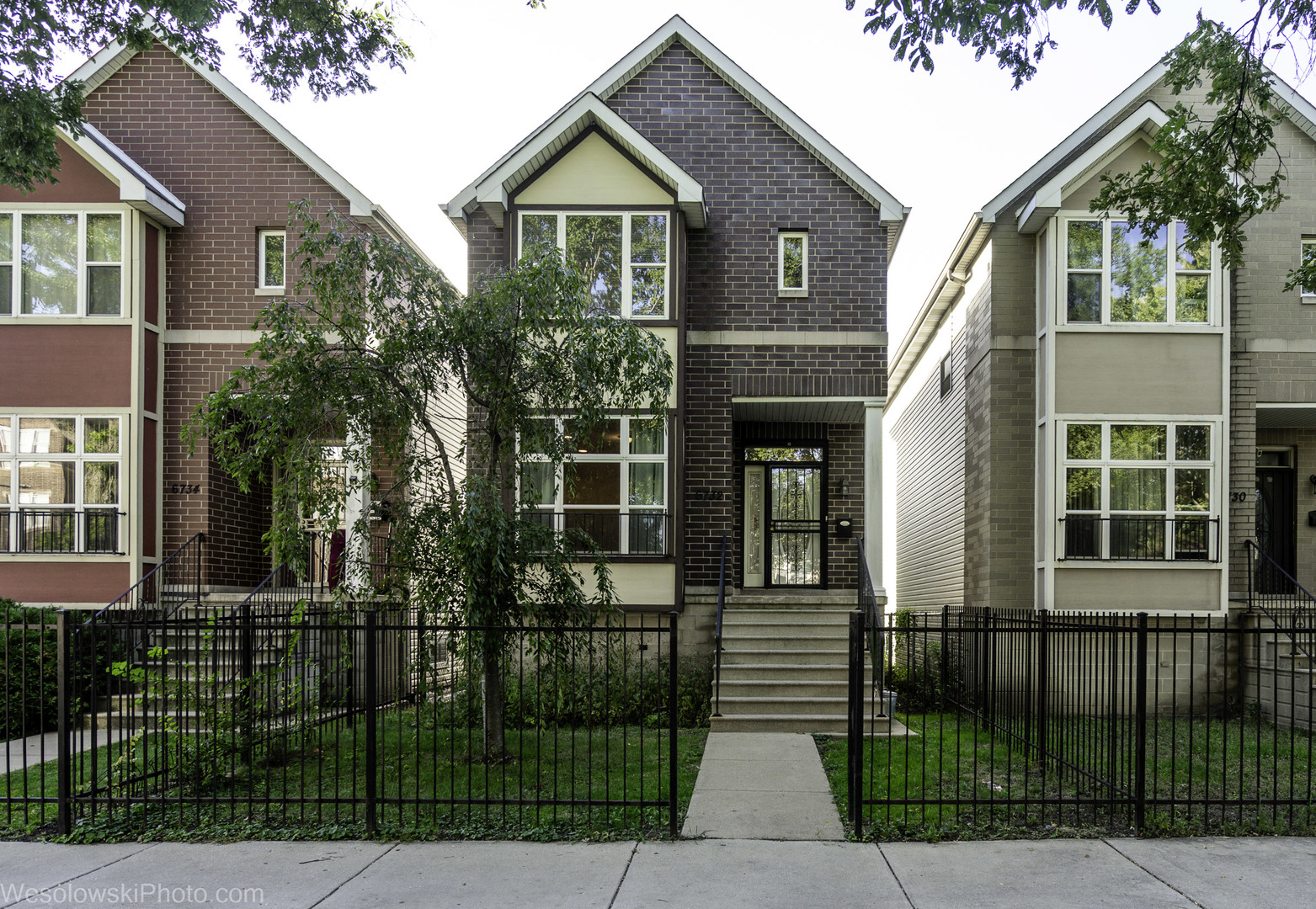 Built on an oversized lot with fruit trees and 2-car garage, this house is within minutes of the award-winning Stony Island Arts Bank, acclaimed Obama Presidential Center, Kenwood Gardens, historic Jackson Park, Lake Michigan and the University of Chicago. The house has an open floor plan with abundant natural light, hardwood flooring on the main level, living room gas log fireplace and stairwell skylight.  The eat-in kitchen features an island, pantry and stainless steel appliances, including an oversized newer refrigerator.  The primary suite and two other bedrooms are on the second level and a spacious fourth bedroom is on the lower level.  The lower level also offers space for a recreation room or home gym.  This house offers complete privacy as no window looks into another residence. The location is within the Wadsworth school district, a public magnet school (K-8) noted for a curriculum heavily focused on science, technology, engineering, and mathematics (STEM).