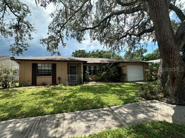 This home offers 2 Bedrooms , 2 Full Bathrooms and a Family Room. Located close to shopping, restaurants and Tampa International Airport.  With a little TLC this home will be perfect for an investor or first time owner who is ready to make this home their own.  Home is being sold as is, set your appointment today and make this home your