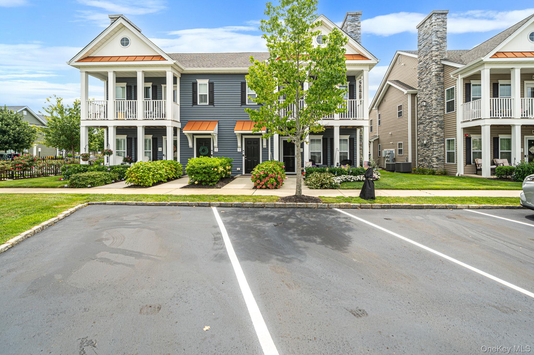 Meticulously maintained two-bedroom condo located in the desirable 55+ community of Westbrook Village. This stylish home features elegant wainscoting and moldings throughout, upgraded appliances including the washer and dryer. The bright, open concept kitchen offers a spacious island and flows seamlessly into the inviting living and dining area, complete with a cozy fireplace. The spacious primary suite includes an en-suite bathroom and an extra large walk-in closet. Custom Hunter Douglas blackout shades with electric/motorized operation and remotely controlled in both the primary suite and the guest room. An airy loft provides the perfect space for a home office or optional den area. Also an additional storm/screen door was installed which leads to a relaxing  balcony overlooking the pool and clubhouse and all its amenities.