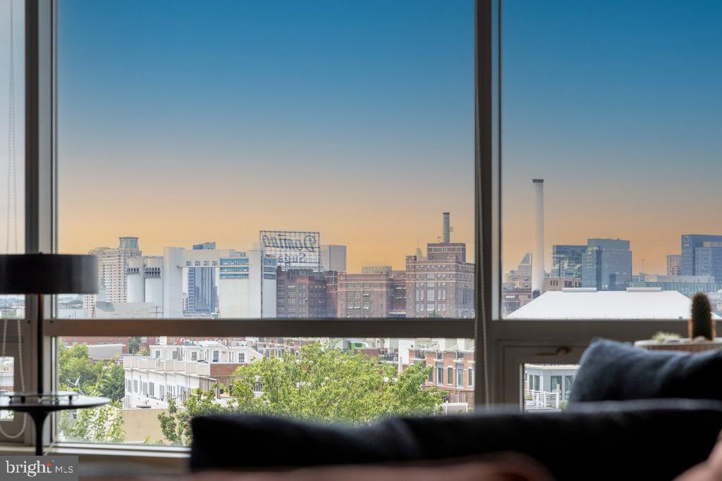 Welcome to this beautifully updated home offering impressive city and skyline views, a spacious private balcony, and glimpses of the water.Thoughtfully improved throughout, this residence blends modern style with everyday comfort. The renovated and expanded kitchen serves as the heart of the home, featuring new stainless steel appliances, quartz countertops, updated cabinetry, a large island with seating, additional pantry storage, and a built-in wine rack. Wide-plank ceramic flooring with a wood-look finish runs throughout the living spaces, adding warmth, durability, and a contemporary feel.The spacious primary suite includes a dressing area, a large walk-in closet, and a well-appointed en-suite bath with a soaking tub, separate shower, double-sink vanity, and new lighted mirrors. The half bath has been beautifully renovated, while new lighting fixtures throughout and a brand-new washer and dryer add to the homes move-in-ready appeal.Head outside to the private balcony, an ideal spot to relax and take in the skyline views, enjoy a morning coffee, or unwind at the end of the day.Located in one of Baltimores most recognizable full-service buildings, Silo Point offers an exceptional collection of amenities, including a 24-hour concierge level service, 19th-floor Sky Lounge, enviable fitness center, yoga room, game room, library, conference room, landscaped courtyard, secure garage parking, bike storage, and on-site management.Stylish, updated, and ready for its next owner, Residence #528 offers a unique opportunity to enjoy modern living, outstanding views, and the sought-after Silo Point lifestyle.