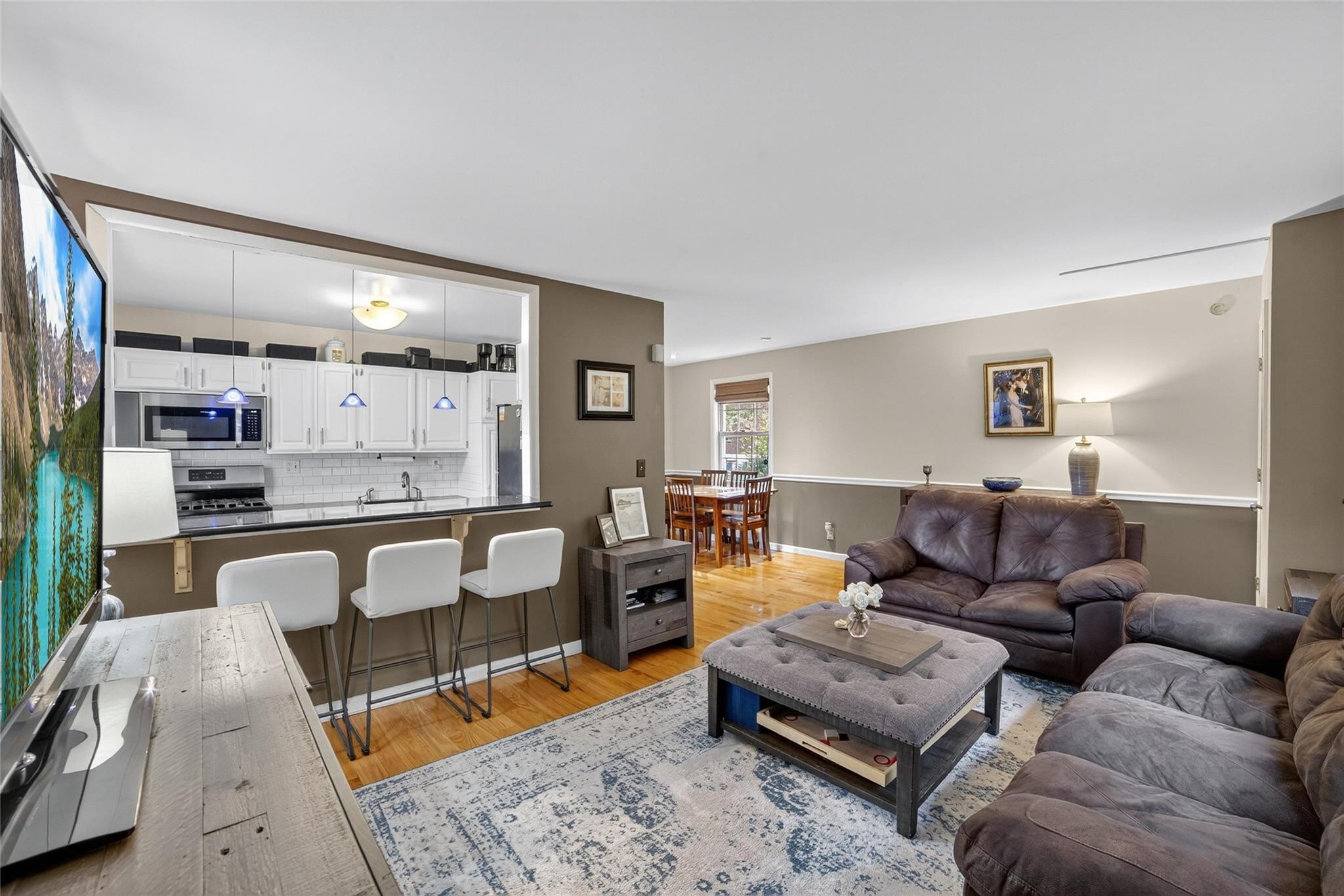 THIS IS YOUR NEXT CHAPTER. Welcome to the prestigious and picturesque REX RIDGE. Step into effortless living in this rare GROUND-FLOOR, 3-bedroom, 2-full bath co-op in Hartsdale’s most desirable garden-style co-op communities! PRIVATE PARKING, PRIVATE ENTRANCE, IN-HOUSE WASHER AND DRYER, PRIVATE IN-GROUND POOL, PRIVATE PLAYGROUND, COURTYARD BBQ AREA, AND PRIVATE WELL-MAINTAINED GROUNDS. YOUR NEW HOME WILL HAVE IT ALL -  AND MAINTENANCE INCLUDES PROPERTY TAXES!

Step inside to beautiful hardwood floors, an expansive living room with separate dining space, and semi-open concept kitchen. The primary bedroom includes an en-suite full bathroom, while two additional bedrooms offer ample closet space and versatility for guests, family, or work-from-home needs. With a tremendous amount of closets throughout, there is no scarcity with storage space. 

The renovated kitchen is both functional and stylish, showcasing crisp white cabinetry, sleek black quartz countertops, and a pass-through wall opening with counter overhang—perfect for casual dining or entertaining. Plus, enjoy the convenience of your own in-unit washer and dryer.
Step outside and enjoy gorgeous courtyard space for al-fresco dining, ideal for summer BBQs, morning coffee, or unwinding in the fresh air. 

At Rex Ridge, enjoy the low-maintenance lifestyle of co-op living with exceptional amenities - you’ll never need to mow the lawn, rake leaves, shovel snow, skim the pool or worry about seasonal upkeep. Additional features include on-site storage units (waitlist), bike storage, and a live-in superintendent. 1  Indoor cat is welcomed (no dogs). Subletting permitted after 3 years, providing flexibility for the future.

Located between the charm of Hartsdale Village and the energy of White Plains, you’re minutes from vibrant restaurants, cafes, shopping, parks, golf courses, and the scenic Bronx River trails. The Metro North Hartsdale Station is just a short drive away, putting you in NYC in just 35 minutes.
A MUST SEE—schedule your private tour today!