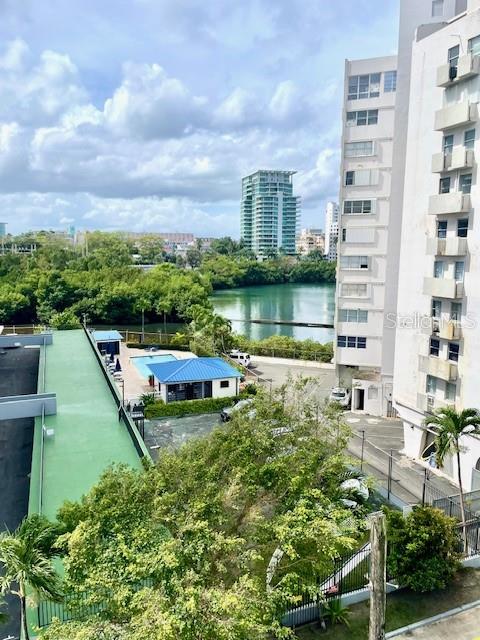 Excellent location in the heart of Condado. Beautiful view to the Condado Lagoon from the living area.  Corner apartment  with excellent cross ventilation. Only two apartments in each floor. Includes living , dining , kitchen, 3 bedrooms and 2 bathrooms and one covered gated parking space .Located  3  to 5 minutes walking  distance to the main hotels in the area such as La Concha Hotel, Vanderbilt Hotel and among other places like  Ventana al Mar , restaurants, stores, beach and lagoon. Very high potential for long and short term rental income and very good to enjoy living in a very exclusive neighborhood.  Must See!