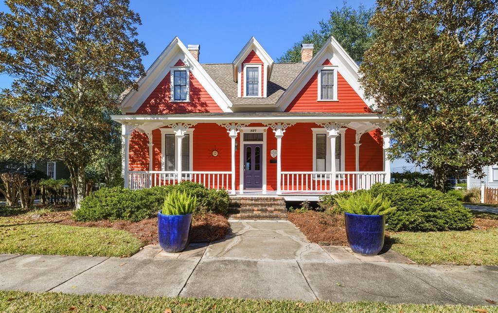 Step into timeless charm in this beautifully renovated two-story Victorian located in the desirable Love/Warren Historic District, just moments from downtown Thomasville. Originally constructed around 1891, this home was thoughtfully restored in the early 2000s, blending historic character with modern systems including updated electrical, plumbing, and HVAC. Just a short walk to the bricks of Broad Street, the location is hard to beat. The main level features a generously sized primary suite with a recently updated bathroom, while the upper floor offers two additional bedrooms and a full bath. Classic details shine throughout, including hardwood floors, soaring 12-foot ceilings, and built-in shelving in the living room, accented by a striking statement chandelier. Enjoy outdoor living from both the welcoming front porch and the screened rear porch, overlooking a manicured yard. The brick patio with firepit provides an ideal space for entertaining, and the property also includes ample off-street parking, a storage shed, and parking space for multiple vehicles.