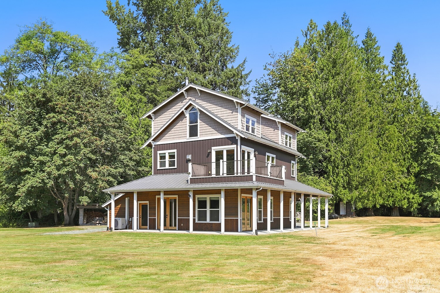 3,012 SQ FT MAIN HOME + 2,603 SQ FT DETACHED ADU (DADU) ON NEARLY 14 ACRES! Rare opportunities like this are becoming increasingly difficult to find. Set on nearly 14 acres of remarkably usable land, this one-of-a-kind estate offers the flexibility today's buyers have been searching for w/a beautifully updated main home, fully renovated DADU w/its own private driveway, massive shop, oversized finished garage w/workshop & bath, artist studio overlooking the creek, & room to grow for generations to come. Whether you're looking to accommodate multigenerational living, generate rental income, operate a home business, create an equestrian property, or simply enjoy the privacy, this property is designed to adapt to your lifestyle. Inside the main home you'll find vaulted ceilings, exposed beams, maple HW floors, a warm & inviting great room centered around a wood-burning stove, updated kitchen, wet bar, & spacious living areas that seamlessly connect to the wraparound porch. Outside, the property continues to impress w/expansive lawns, fruit trees, mtn views, ATV trails, fire pit patio, & peaceful Gilligan Creek winding through the property. Every improvement has been thoughtfully completed so you can spend less time updating & more time enjoying everything this exceptional property has to offer. Estates offering this combination of acreage, income potential, privacy, & versatility rarely become available. Mortgage savings may be available for buyers of this listing!