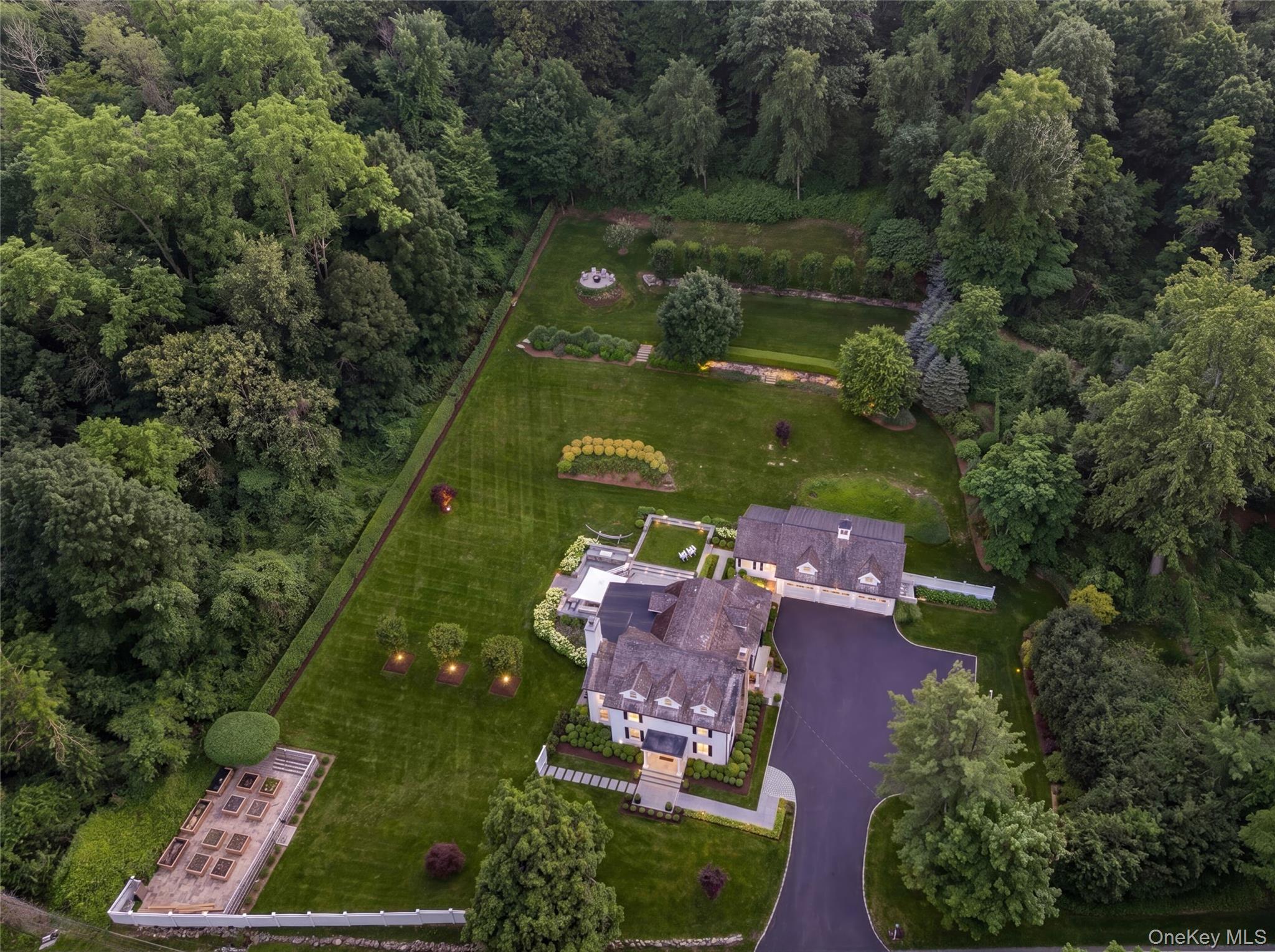 A Rare Opportunity Where History Meets Modern Living.Built in 1750 and thoughtfully renovated in 2005. White clapboard, black shutters, cedar shake roof, and copper gutters set a timeless exterior, framed by professionally designed grounds.A wide entry hall opens to living and dining rooms bookended by floor-to-ceiling stone fireplaces. Hardwood floors and detailed millwork mark the quality craftsmanship throughout every room.The main house offers four bedrooms and three and a half baths. The gourmet kitchen anchors daily life. Sub-Zero and Viking appliances, generous custom cabinetry, and a large center island flows into a family room that opens directly onto the patio and gardens.The primary suite is a retreat in its own right: vaulted ceilings, a stone fireplace, walk-in closet, and a spa-inspired bath with soaking tub and glass-enclosed shower.A separate carriage house extends the home’s character and livability. The main level offers a welcoming sitting room, while upstairs an open living area with kitchenette is bathed in natural light. Equally suited to hosting guests or serving as a private studio or work-from-home retreat. Outside, grounds designed by acclaimed landscape architect Jan Johnsen unfold around an oversized stone patio with outdoor kitchen, generous space for hosting friends, or enjoying the surrounding beauty in complete privacy. A vegetable garden and expansive lawn extend the property further, all bordered by protected land that offers a balance of openness and seclusion that can’t be replicated.A heated three-car garage rounds out the property. Byram Hills School District. Chappaqua train parking eligibility.