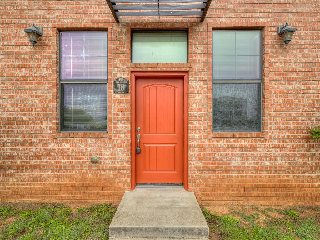 Welcome to Old Towne Lofts in East Norman, located less than 5 minutes away from the OU campus! This stunning and sleek 2-story condo features 2 spacious bedrooms, 2 baths upstairs, and 1 half bath off of the living area downstairs. The concrete flooring throughout the first level gives the home a cool, industrial vibe. The galley kitchen comes with granite countertops and breakfast bar, glass tiled backsplashes, and all electric appliances that include a refrigerator, microwave, and smooth top stove. You'll also have the convenience of a stackable washer and dryer tucked away off the dining space! Upstairs, each bedroom comes with wood flooring and its own full bathroom for privacy! The private back patio is accessible right off the kitchen and has plenty of room for a grill plus outdoor furniture! This condo is maintenance-free with water and trash service, exterior and lawn care covered by the HOA. Seller is providing a First American Max Plan home warranty.