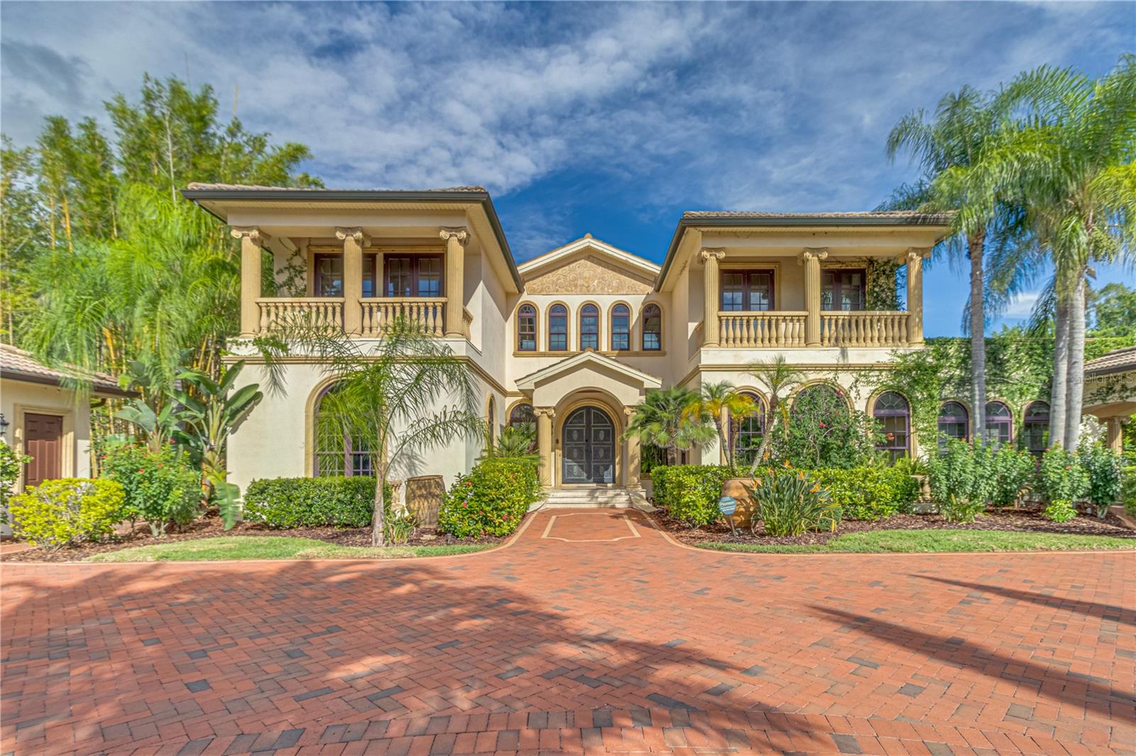 Experience Unparalleled Elegance at Villa Adriana: A Legacy Estate Awaiting Its Next Chapter.Nestled within the exclusive, double-gated enclave of Bellamere a 20 Acre 4 lot community, Villa Adriana stands as a testament to timeless Mediterranean-revival architecture and modern luxury. This extraordinary estate, spanning over 5 acres of impeccably manicured grounds, offers breathtaking, uninterrupted vistas of the tranquil Lake Kell. Crafted with a masterful touch, this 6-bedroom, 6.5-bathroom residence spans 6,820 square feet of exquisite living space. The home’s interior is a curated collection of authentic, artisanal details, including Venetian plaster walls, Baroque-style painted and gold leaf ceilings, and a dramatic travertine staircase with a custom iron rail. The ambiance is elevated by 10 Swarovski crystal chandeliers, bespoke cherry cabinetry, and polished aged granite flooring that flows throughout the home.The gourmet kitchen is a chef's dream, featuring a suite of professional-grade Wolf/Sub-Zero appliances, perfectly complemented by a separate fully equipped butler's kitchen. The home's technological infrastructure is as sophisticated as its design, with integrated Vantage lighting controls, a state-of-the-art home theater, and a comprehensive security system. A dedicated library/office, gym, and multiple living spaces, including an oversized family room, provide a seamless fusion of functionality and grandeur.The exterior is an entertainer’s paradise. A lavish saltwater pool with an integrated spa, sundeck, and cabana creates a resort-like atmosphere. The lush Tuscan-themed landscaping enhances the property’s "Old World" charm, while a screened gazebo on the dock, over the water, provides a serene retreat for enjoying the lake views. Four garage spaces and a workshop area offer ample room for a collection of vehicles and hobbies.Perfectly positioned with swift access to I-275, I-75, Dale Mabry Hwy, Us 41 and the Veterans Expressway, Villa Adriana offers a secluded sanctuary while keeping the world-class amenities of Greater Tampa Bay—including upscale shopping, fine dining, professional sports, and pristine beaches—within effortless reach. Villa Adriana is more than a home; it is a legacy—a masterpiece that demands to be experienced in person.