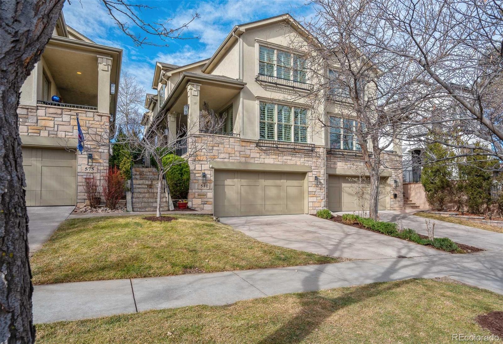 Enjoy the Cherry Creek Lifestyle in this impeccably maintained, light-filled townhome, ideally located near all the premier shopping, dining, and amenities that Cherry Creek has to offer. This lovely home features a spectacular updated custom eat-in Kitchen with sleek quartz countertops and high-end appliances, along with expansive living and dining areas, well suited for both everyday living and posh entertaining. Dreamy outdoor spaces include a rare private backyard, with a flagstone patio and covered outdoor Living Room, surrounded by breathtaking mature rose bushes and trees, a secluded paradise, perfect for morning coffee and warm-weather parties. Multiple drip lines for garden pots and side beds for the gardening enthusiast, as well as a gas-line for the grill. An elegant tiled front veranda, accessible through French doors, adds to the home’s charm.  Cozy fireplaces enhance both main level living areas. Upstairs the grand and peaceful Primary Suite offers its own inviting fireplace, custom walk-in closet, five-piece, spa-like Bath, and private deck. Two additional bedrooms complete the upper level, one with glass double doors, ideal for a home office.The finished lower level includes a wonderful Media Room, as well as a fourth Bedroom and full bathroom, perfect for welcoming guests.Hardwood floors on the main level, new carpet, and plantation shutters throughout, built-in speakers throughout. An exquisite home just waiting for you to make it your own. No HOA. Party wall agreement only.