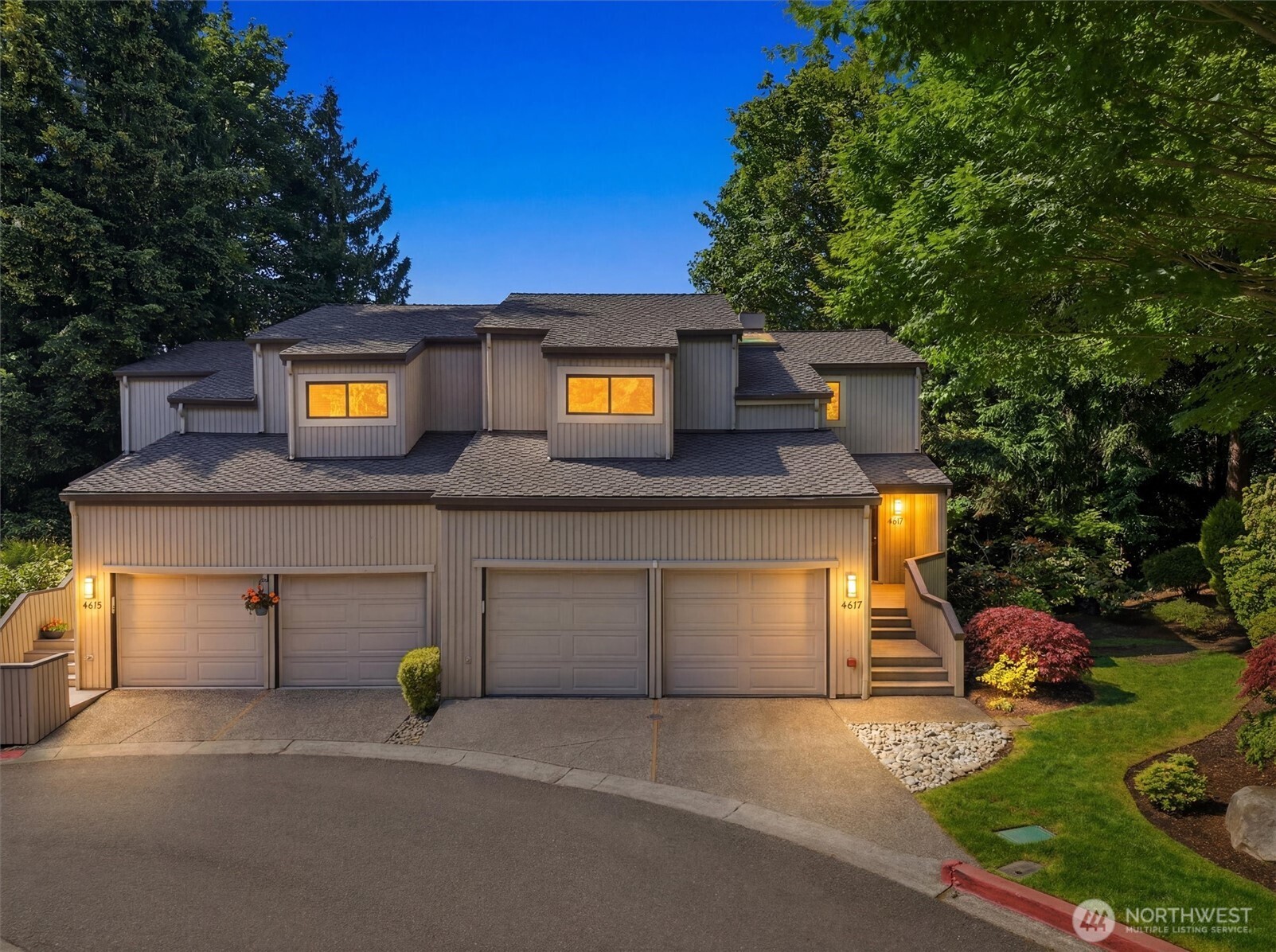 Perched in the exclusive Yarrow Hill gated enclave, this exceptional townhome offers stunning views from every floor and a serene sunroom overlooking the shimmering waters of Yarrow Bay. Soaring vaulted ceilings and an open-concept main level create a spacious, refined atmosphere, while the gourmet kitchen featuring a Sub-Zero refrigerator, polished granite countertops, and custom built-in cabinetry sets the tone for elevated living. Two gas fireplaces, brand-new carpet, and a west-facing balcony framing iconic Olympic Mountain sunsets make this home as inviting as it is impressive. Mature trees envelop the property in seclusion and privacy rarely found so close to the Eastside. The versatile floorplan adapts to your lifestyle, whether a home office, gym, or guest quarters. A finished attic, utility room, and 2-car garage with floor-to-ceiling shelving ensure storage is never a compromise. HOA covers exterior maintenance including roof and siding for true lock-and-leave living. Steps from Carillon Point Marina, the Cross Kirkland Corridor, and downtown Kirkland, with seamless access to Bellevue and Seattle. A tranquil retreat with unmatched connectivity.