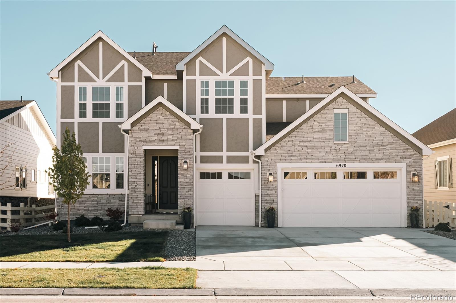 Backing to open space and steps from the Aurora Reservoir, this incredibly popular Dillon model featuring 6 bedrooms, 5 baths and a finished walkout basement is now available in the highly desired Southshore neighborhood in SE Aurora. Built with countless design upgrades, this home opens to a dedicated dining room with upgraded lighting, wide plank luxury vinyl flooring and smartly implemented butler's pantry with beverage fridge. The main living space of the home dramatically opens to vast views of pastures with frequent wildlife visitors including cows and pronghorn grazing behind the home. The kitchen offers upgraded GE Café appliances including an oversized gas range, quartz countertops, large center island with dramatic pendant lighting and gorgeous dine in sunroom with Reservoir views. The living room features upgraded 12 ft pocket sliding glass doors that open to the covered patio and upgraded gas fireplace with dramatic black herringbone tile surround. The main floor offers a guest bedroom with 3/4 bath that could also be used as home office and oversized mudroom with drop zone and laundry. Upstairs, the Primary Suite is privately removed off the large loft with pasture views and five piece bath with quartz countertops, frameless glass shower and walk in closet. Three additional bedrooms are located upstairs, one of which offers an ensuite bath while the other two share a secondary bath with dual sinks and tub/shower combo. The finished walkout basement offers a secondary living space (TV included w/theatre sound system!) and bonus room that would be perfect for a second home office, gaming room or home gym. An additional bedroom and 3/4 bath is also located in the basement. Southshore is a very special community in SE Aurora as it is the only neighborhood that offers multiple community pools, two clubhouses each with private resident gyms, a community dog park, miles of trails, parks and is in walking distance to schools in the Cherry Creek School District!