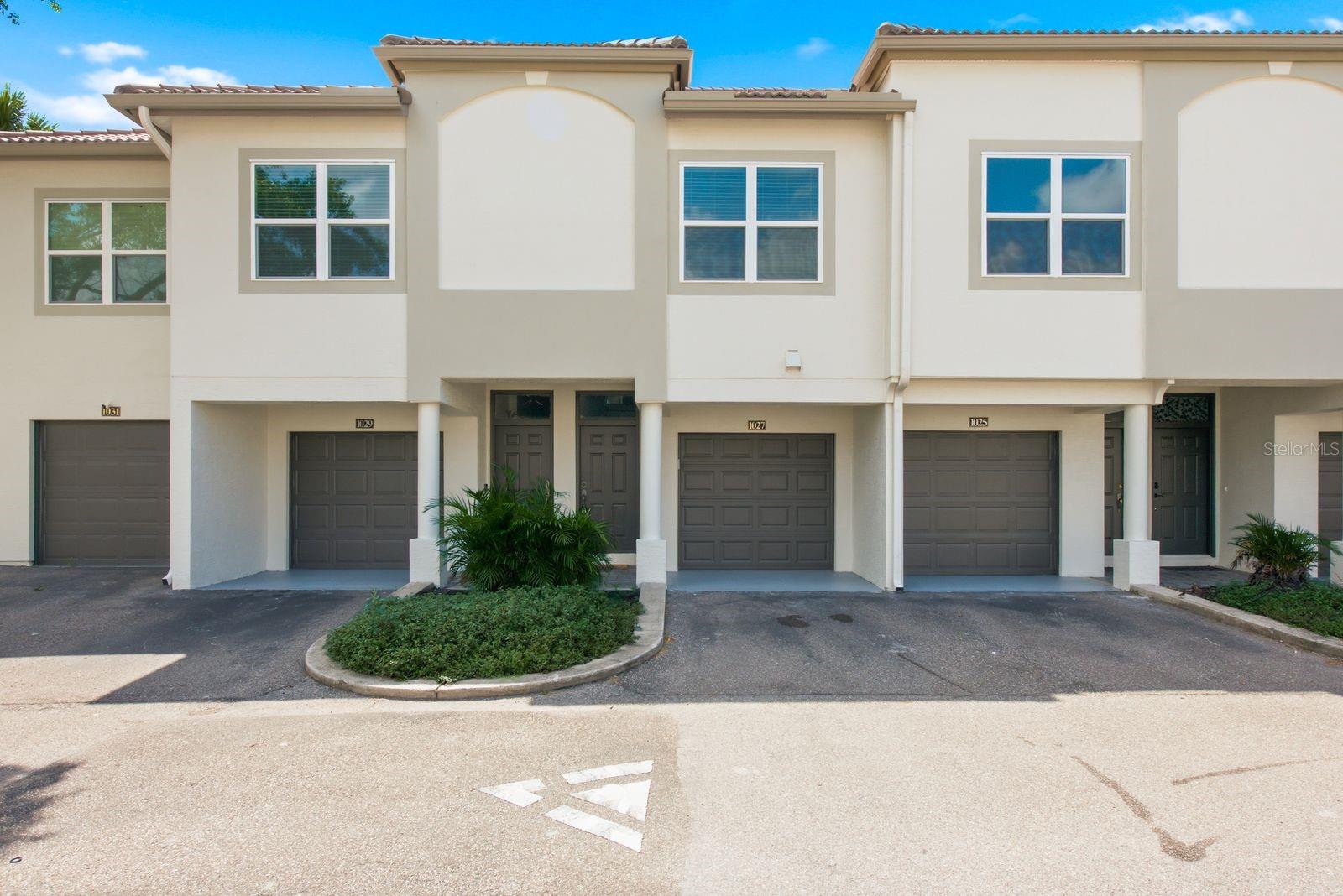 Under contract-accepting backup offers. Harbour Island is one of Tampa's most coveted addresses, and this two-bedroom, two-bath townhouse-style condo at Island Walk puts you right in the middle of it. Walk to Amalie Arena, cross over to Water Street and the Riverwalk, or just settle into being tucked deep in South Tampa. The location does most of the talking here.Inside, the two-story layout works in your favor. Garage and entry sit on the ground floor, while the living space, both bedrooms, two full baths, and in-unit laundry are all upstairs, away from street noise. The home has been nicely updated throughout, with quartz countertops and a smart fridge in the kitchen. HVAC was replaced in 2020. A screened porch gives you outdoor space without the full Florida sun, and the lot sits on the channel with a conservation view, so what's out back is water and green space instead of another building.Community amenities are resort-caliber: two pools, a jacuzzi, a fitness center with a dedicated cardio room, tennis courts, and a playground. The HOA covers water, grounds maintenance, pool care, and valet trash pickup, and the community is gated with RFID entry.Zoned for Gorrie Elementary, Wilson Middle, and Plant High School. Pets welcome, no buyer approval required. Harbour Island doesn't open up like this often, especially with a channel view attached.