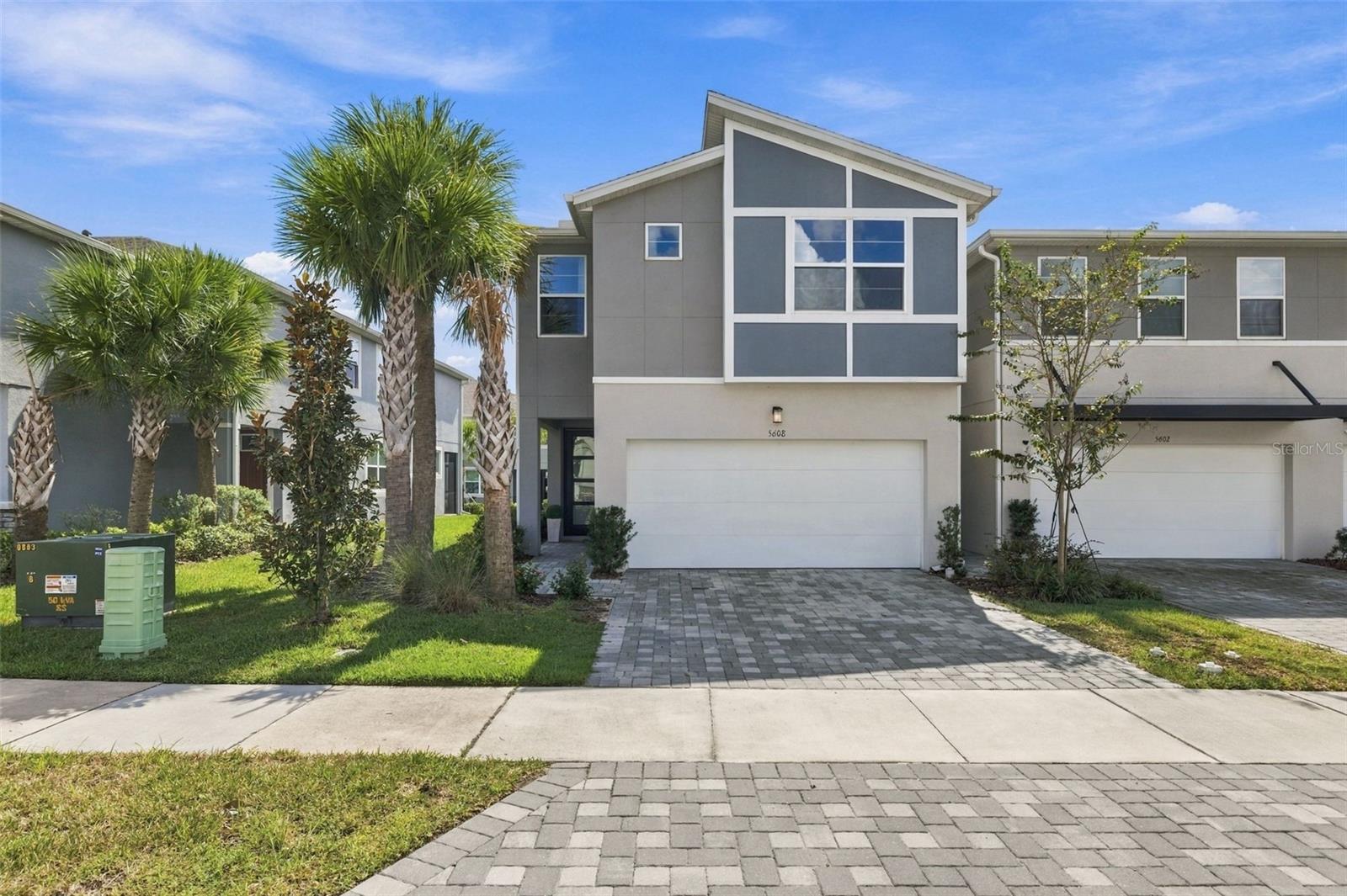 WHERE MODERN LUXURY MEETS SPACIOUS LIVING! Built in 2024, this beautifully upgraded two-story townhome in the desirable Chapel Crossings community offers 4 bedrooms, 3 full bathrooms, 2,586 square feet of living space, and a 2-car garage. With its spacious layout, contemporary finishes, and thoughtfully designed living areas, this home offers the comfort and functionality of a single-family residence with the convenience of townhome living. Step inside to an inviting open-concept floor plan where the kitchen, dining, and living areas flow seamlessly together, creating the perfect setting for everyday living and entertaining. The designer kitchen is truly the centerpiece of the home, featuring stunning quartz countertops, upgraded Sonoma Linen cabinetry with brushed nickel hardware, stainless steel appliances, abundant storage, and an oversized center island with additional seating. Luxury vinyl plank flooring extends throughout the main living areas, complementing the home's modern, neutral finishes. Sliding glass doors lead to a fully screened-in lanai, providing the perfect extension of your indoor living space. A first-floor bedroom and adjacent full bathroom with a walk-in shower adding flexibility for guests, a home office, or multigenerational living. Upstairs, you'll find an impressively spacious loft that functions beautifully as a second living room, media space, or playroom. The primary suite is a true retreat, complete with a spa-inspired bathroom featuring dual vanities, an oversized walk-in shower, and a generous walk-in closet. Two additional bedrooms, each with walk-in closets, share a full bathroom, providing plenty of space and storage throughout. Additional highlights include a 2-car garage, upgraded cabinetry and countertops throughout, and integrated smart home technology featuring an Ecobee thermostat, Clare video doorbell, and touchscreen alarm keypad. LOCATION, LIFESTYLE, AND CONVENIENCE! Nestled in the sought-after Chapel Crossings community in Wesley Chapel, residents enjoy access to an impressive collection of resort-style amenities, including a community pool, clubhouse, fitness center, playgrounds, and recreational spaces designed for an active Florida lifestyle. Ideally situated near everyday conveniences, this location places you just minutes from Publix, shopping, dining, and entertainment, with The Shops at Wiregrass and Tampa Premium Outlets just a short drive away. Convenient access to major roadways makes commuting throughout the Tampa Bay area a breeze. Enjoy the perfect combination of newer construction, elevated finishes, exceptional living space, and a community designed for enjoying the best of Wesley Chapel. Schedule your private tour today!
