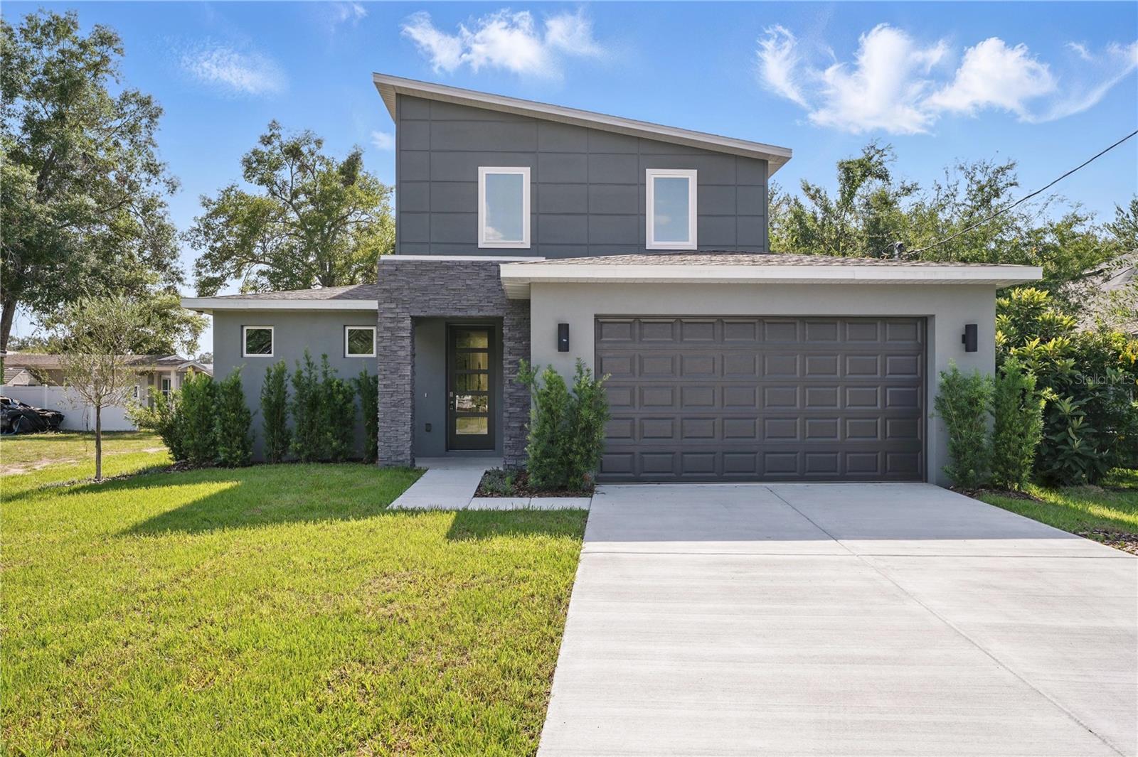 Experience the best of College Park living in this brand-new construction, architecturally striking home just steps from Historic Dubsdread Golf Course and the iconic Taproom restaurant. Featuring bold modern design that complements the neighborhood's character, this home offers durable SPC vinyl plank flooring in all common areas including the staircase, loft and primary bedroom. It also includes soaring ceilings and a spacious open-concept great room. The gourmet kitchen boasts, white cabinets and quartz countertops, oversized walk-in pantry, black hardware, designer lighting, large island with seating, and a separate bar with wine fridge. The first-floor primary suite is a retreat with a giant his/hers walk-in closet and a spa-like bath with bold design choices. Upstairs, enjoy a versatile loft, three bedrooms and designer guest bath. With a mudroom, 2-car garage, irrigation system, 10-year warranty and room for a future pool, this home perfectly blends style, comfort, practicality and location.