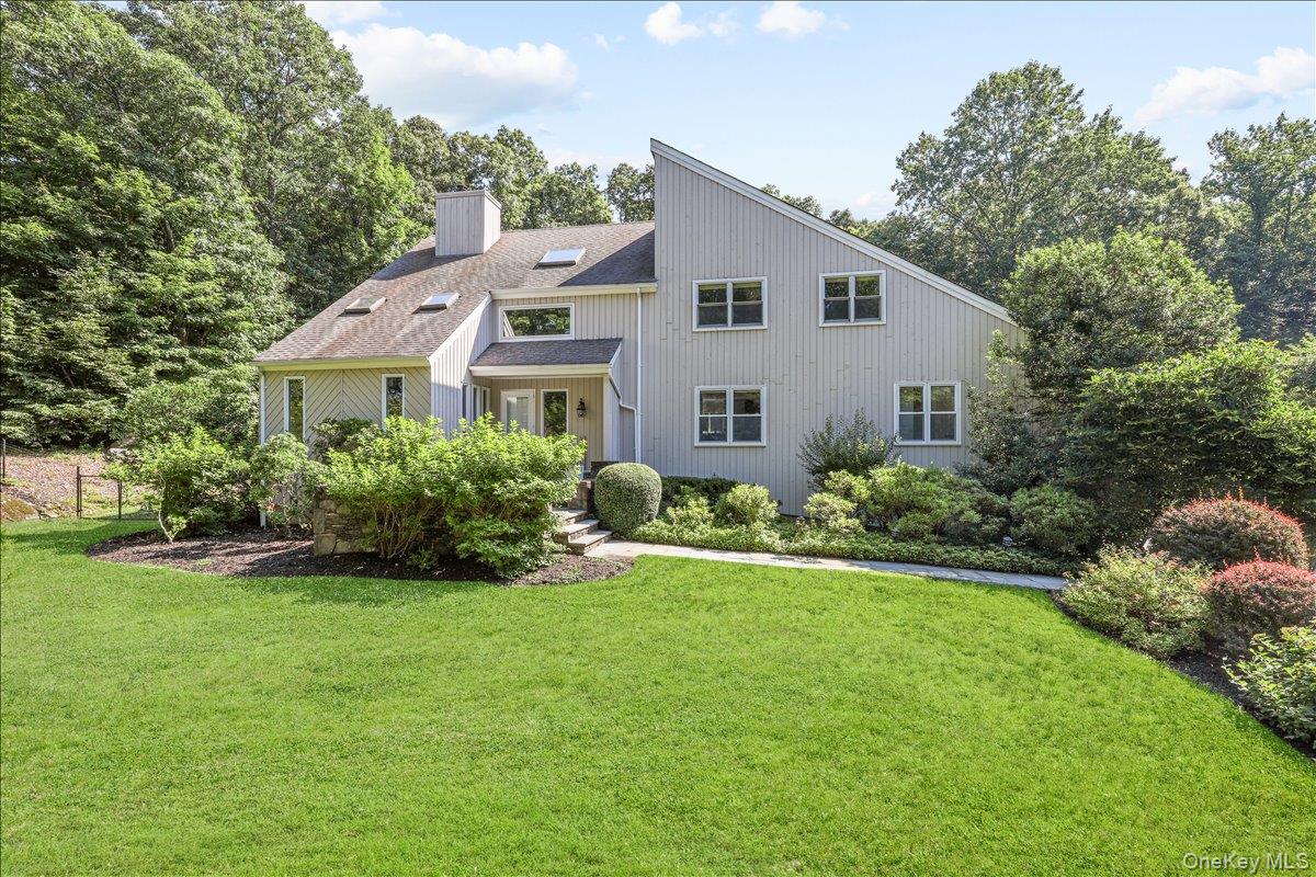 Tucked away at the end of a quiet cul-de-sac, this exceptional home offers the perfect blend of privacy, luxury, and effortless indoor-outdoor living on 2.30 beautifully landscaped acres. The heated Gunite pool, with a premium Luna Quartz finish, creates a true resort-style oasis, while the screened-in porch and expansive rear deck overlook professionally landscaped grounds, providing the perfect setting for relaxing or entertaining. Inside, this thoughtfully updated home features 4 bedrooms, 3.5 baths, and an office on the first floor that could be used as a first-floor guest suite with a full bath. The beautifully renovated kitchen is the heart of the home, showcasing premium Thermador appliances, striking quartzite countertops, abundant cabinetry, and generous prep space. Sun-filled living areas, enhanced by hardwood floors and two fireplaces, offer warm and inviting spaces for everyday living and entertaining. Perfectly positioned on a coveted cul-de-sac, and bordered by protected conservation land, this turnkey property also offers the peace of mind of an automatic whole-house generator, ensuring comfort and convenience year round.