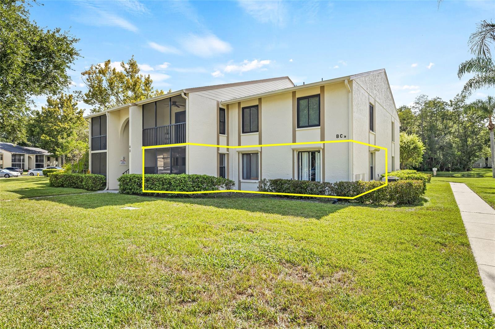 LOCATION, LOCATION! This this 2-bedroom, 2-bathroom CORNER unit on the FIRST floor is spacious, includes laundry room with washer and dryer and has screened-in balcony. The ALL-AGES community of Pine Ridge offers a clubhouse, heated pool and jacuzzi, tennis courts, and assigned parking.  Low quarterly condo fees include water, trash, cable, escrow reserves, and exterior maintenance. Enjoy resort-style amenities including a luxury pool and spa, tennis courts, fitness center, and included utilities like water, sewer, trash, cable, and WiFi—all wrapped into your low monthly fee. Located just steps from the scenic Pinellas Trail, you’ll love having outdoor adventure right outside your door. Upon your arrival at the property you will enjoy your own assigned parking spot, along with the community amenities that include a Pool/Spa, Pond with picturesque Water Fountain, BBQ, Playground, Tennis courts, walking paths, and a full community center. Community has matured and well-manicured landscape. This peaceful neighborhood is the perfect location to unwind after a long day at the office, or to work at home and enjoy the views. Walk to highly rated Elementary and High School. This condo is right in the middle of shopping and restaurants, with easy access to East Lake Road, Trail, Chestnut Park at Lake Tarpon & YMCA. A short drive will bring you to the historic Tarpon Springs sponge docks. Howard Park Beach & Sunset Beach. Tampa International Airport & St. Pete Airports are all just 25 min. Schedule a showing Today! Just minutes away, enjoy the charm of Tarpon Springs including the historic Sponge Docks, authentic Greek dining, Fred Howard Park, Anclote Key Preserve, and scenic trails like the Pinellas Trail.