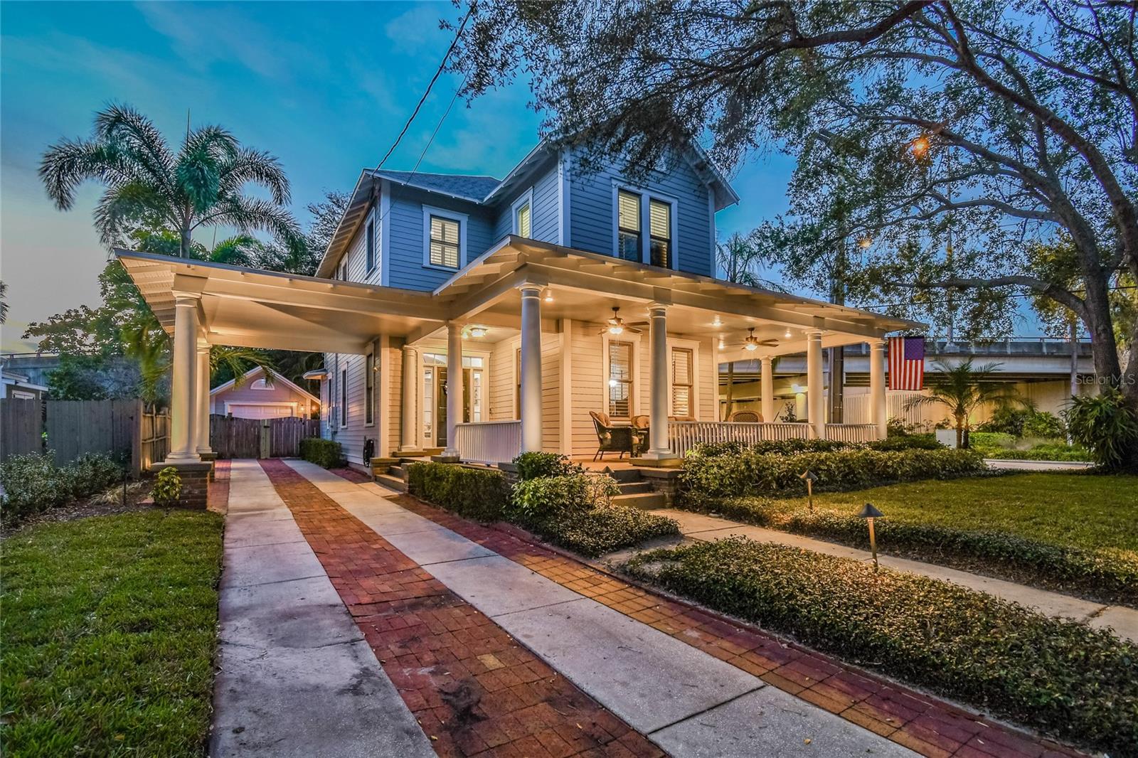 Nestled in the heart of one of Tampa’s most prestigious historic neighborhoods, this classic custom bungalow offers unbeatable walkability to the best of Hyde Park and South Tampa. Blending timeless charm with the expectations of modern design and construction (built in 2000), the home is perfectly suited for both everyday living and entertaining—especially during Gasparilla season! Expansive enclosed porches seamlessly connect to a spacious open floor plan, featuring a solid foundation, 10-foot ceilings, and custom windows adorned with plantation shutters throughout. The chef’s kitchen showcases 42-inch cabinetry and a custom statement island, anchoring the vibrant main living space. Upstairs, two separate primary suites provide exceptional privacy, each with spa-inspired en-suite baths, oversized showers, generous walk-in closets, and designer finishes. A conveniently located laundry area and an enclosed office nook complete the second level. Downstairs, a well-appointed private guest suite offers a large closet and an adjacent full bathroom. The rear porch opens to a fully paved patio surrounded by lush tropical landscaping and a tranquil rock fountain. Adding exceptional versatility, the property also includes a 240 interior heated/air conditioned separate casita featuring a studio layout with a full bathroom—ideal for guests, a private home office, gym, or additional flex space. Relax on the wide, wraparound porches and enjoy views of the Swann Pond fountains while soaking in the vibrant energy of this sought-after neighborhood. Just two blocks from Hyde Park Village, residents enjoy access to dozens of upscale shops and restaurants, and within eight blocks lies Bayshore Boulevard, multiple parks, two major grocery stores, and over 30 popular dining and entertainment destinations along South Howard Avenue. Recently named the best place to live in Florida, Hyde Park offers an unparalleled lifestyle—one this exceptional home delivers and more.