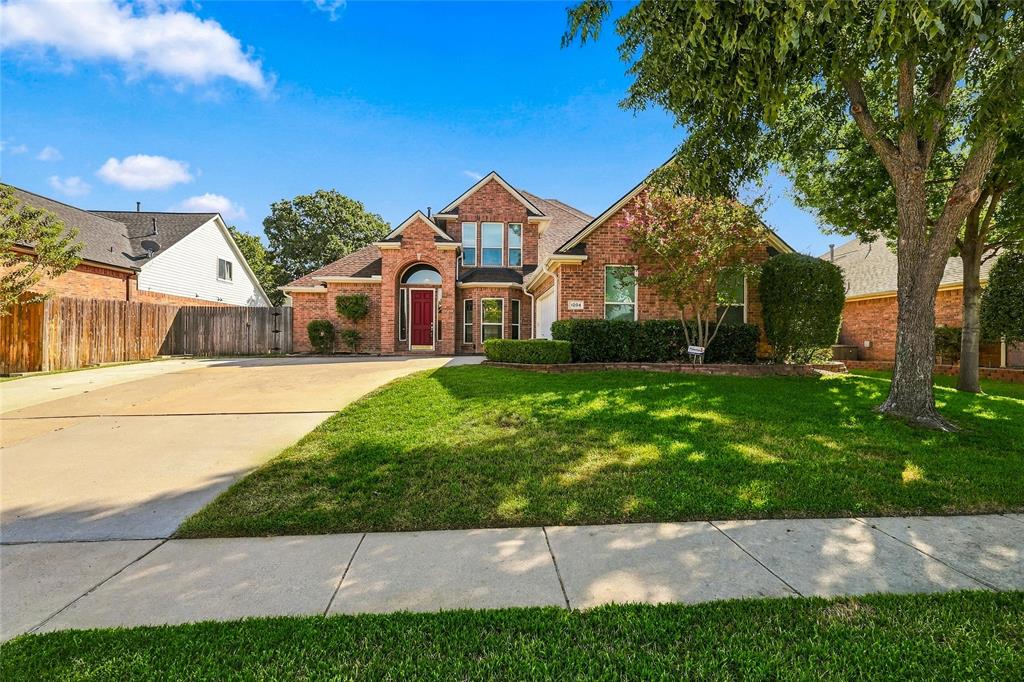 WELCOME HOME! This spacious 4 bedroom, 3.5 bath Bedford home offers plenty of room to gather, entertain and spread out. The large primary suite is conveniently located downstairs and features direct access to the backyard, creating an easy connection to the outdoor living space and diving pool. The spacious primary bath offers dual sinks, a large soaking tub and a separate walk in shower, creating a comfortable retreat at the end of the day. The generous kitchen is the heart of the home with a center island and an open flow into the breakfast area and living room, perfect for everyday living or hosting family and friends. The living room offers a beautiful gas fireplace. Upstairs, you will find a second living or family room along with three oversized bedrooms featuring tall ceilings and plenty of space. Step through the upstairs family room onto the balcony overlooking the backyard and pool, a wonderful spot to relax and enjoy the view. With multiple living areas, spacious bedrooms, an open gathering space and a backyard designed for fun, this home offers room for everyone to enjoy! Don't miss the fun lights on the exterior of the home, change colors for your favorite team, holiday or celebration!