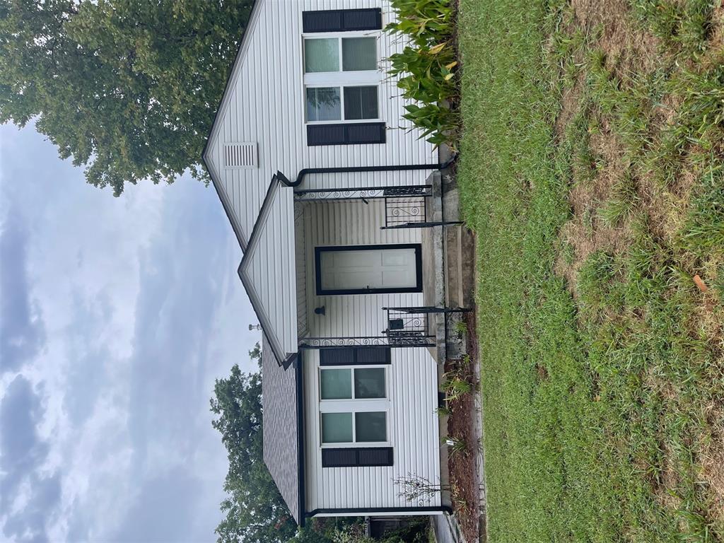 This adorable 2 bedroom, 1 bath bungalow is just one block north of Main St. & Sprouts, shopping & entertainment.  Close to OU campus.  Lovely hardwood floors in main living space.  Kitchen has floor-to-ceiling cabinets, gas stove & SS one-piece sink.  Dining room is just off the kitchen and filled with sunlight.  There is also a breakfast room or cozy study nook off the back of the home, along with inside utility.  Loads of flex space for storage, etc.   The bedrooms are spacious.  Updated bathroom has a pedestal sink and decorative wainscoting.  Most rooms have ceiling fans.  Newer vinyl windows and updated HVAC.  Roof in 2023, including decking.  Easy maintenance vinyl siding and guttering around the home.  Huge back yard, concrete paved patio, shade trees, fully fenced, storage building & backyard alley access.  Come see this hidden jewel.