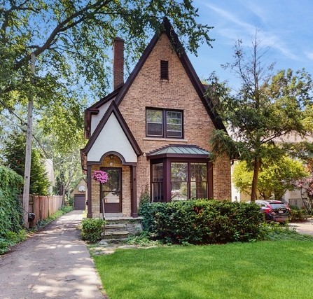 Distinctive architecture, throughout this Tudor-style home with a steep gabled roof.  Spacious living room with prominent fireplace, a formal dining room, and a large cathedral ceiling family room are just a few of the special features.  Beautifully refinished floors through. Large lot.  Short walk to the train lake and award-winning Joseph Sears School.  Home is being sold as-is.