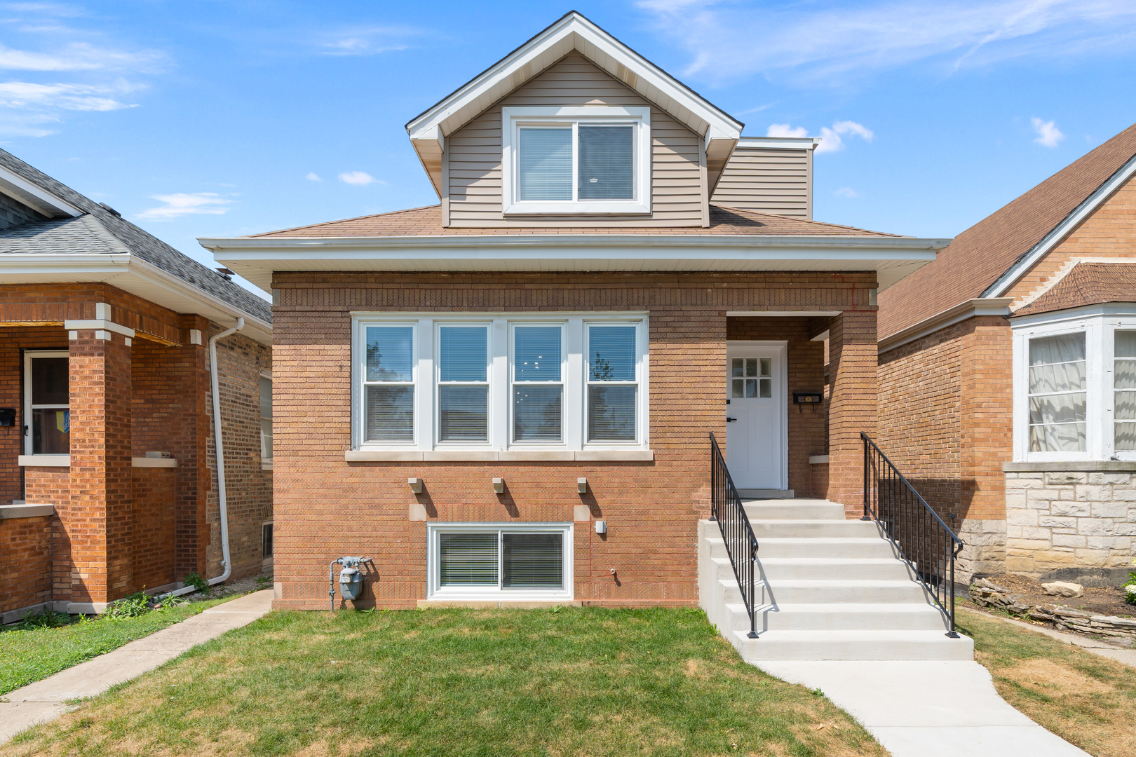 Experience the perfect blend of modern luxury and timeless charm in this fully renovated brick bungalow in Chicago's highly desirable Portage Park neighborhood. This 5-bedroom, 3-bath home offers an exceptional layout: two spacious bedrooms and a stunning chef's kitchen with premium stainless steel appliances on the main level, a gorgeous upper level with two bedrooms, a full spa-like bathroom, closets, and its own separate heating and cooling system, plus a fully finished basement featuring a large recreation area, laundry space, a full bathroom, and a private bedroom-ideal for guests or extended family.    Enjoy peace of mind with new windows, a brand-new oversized 2-car garage, and abundant yard space perfect for family gatherings. Every detail has been thoughtfully updated, from the modern lighting and sleek bathrooms to the beautiful hardwood floors and designer finishes throughout.    Located just minutes from Portage Park, shopping, dining, schools, public transit, and major expressways, this home offers the lifestyle and convenience you've been searching for. Move-in ready and designed to impress-this is the one you've been waiting for!  schedule a showing before is gone.